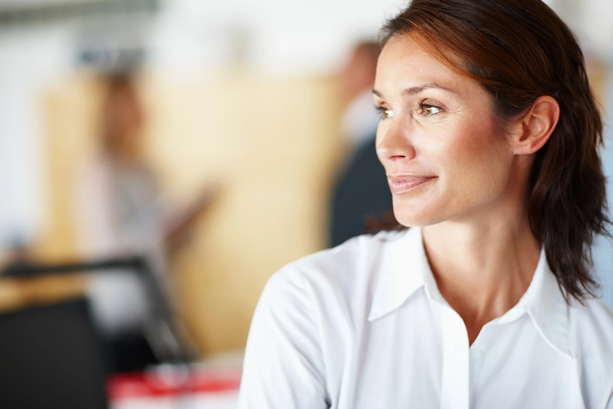 Woman smiling, representing Flouria's perimenopause care