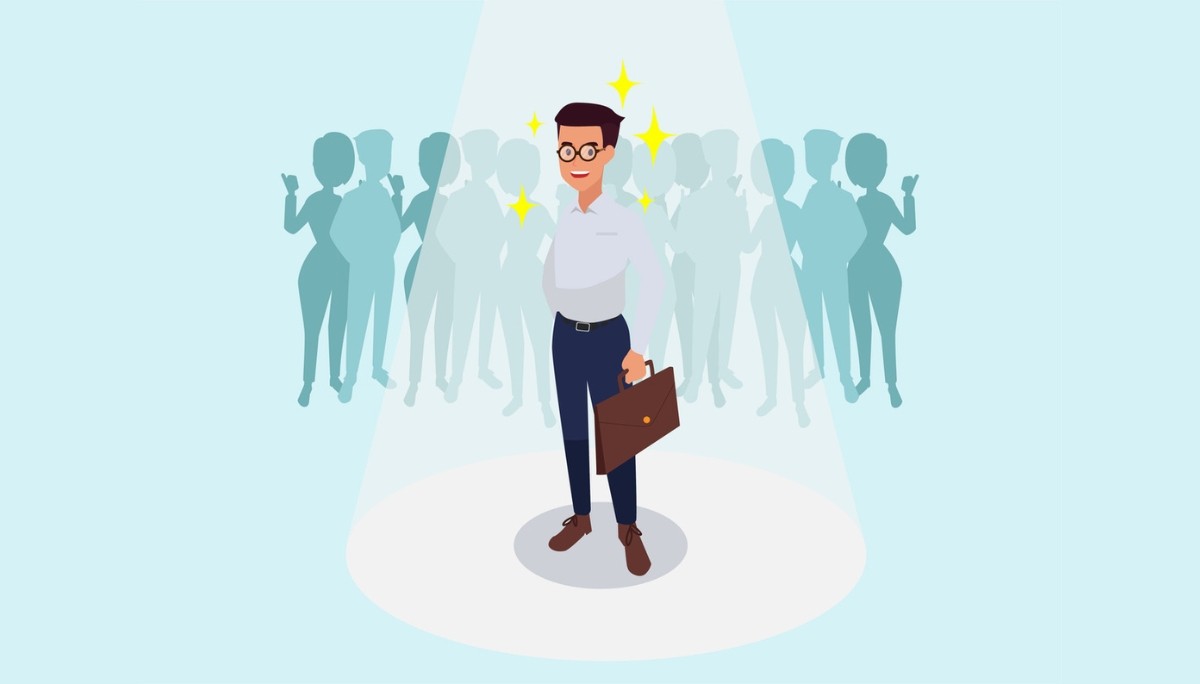 Illustration of a confident candidate standing under a spotlight with a briefcase, surrounded by silhouettes—symbolizing how standout answers to “Why should we hire you?” can set you apart and win the job.