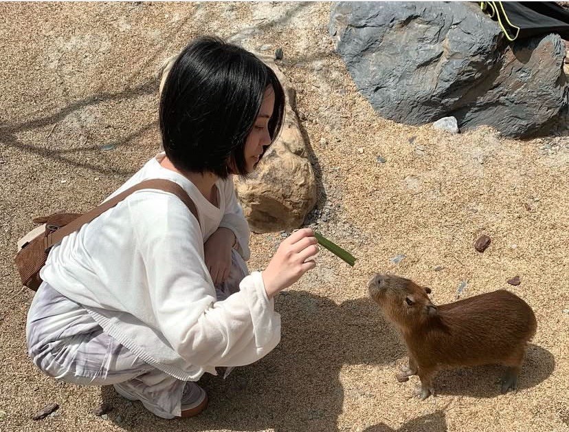 Peace Badejo, wearing sunglasses, looking to the left.
