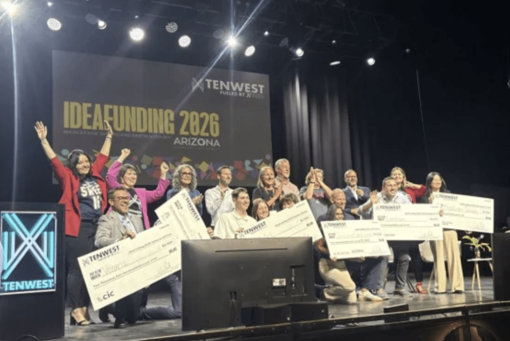 a black and white living room with a large tv