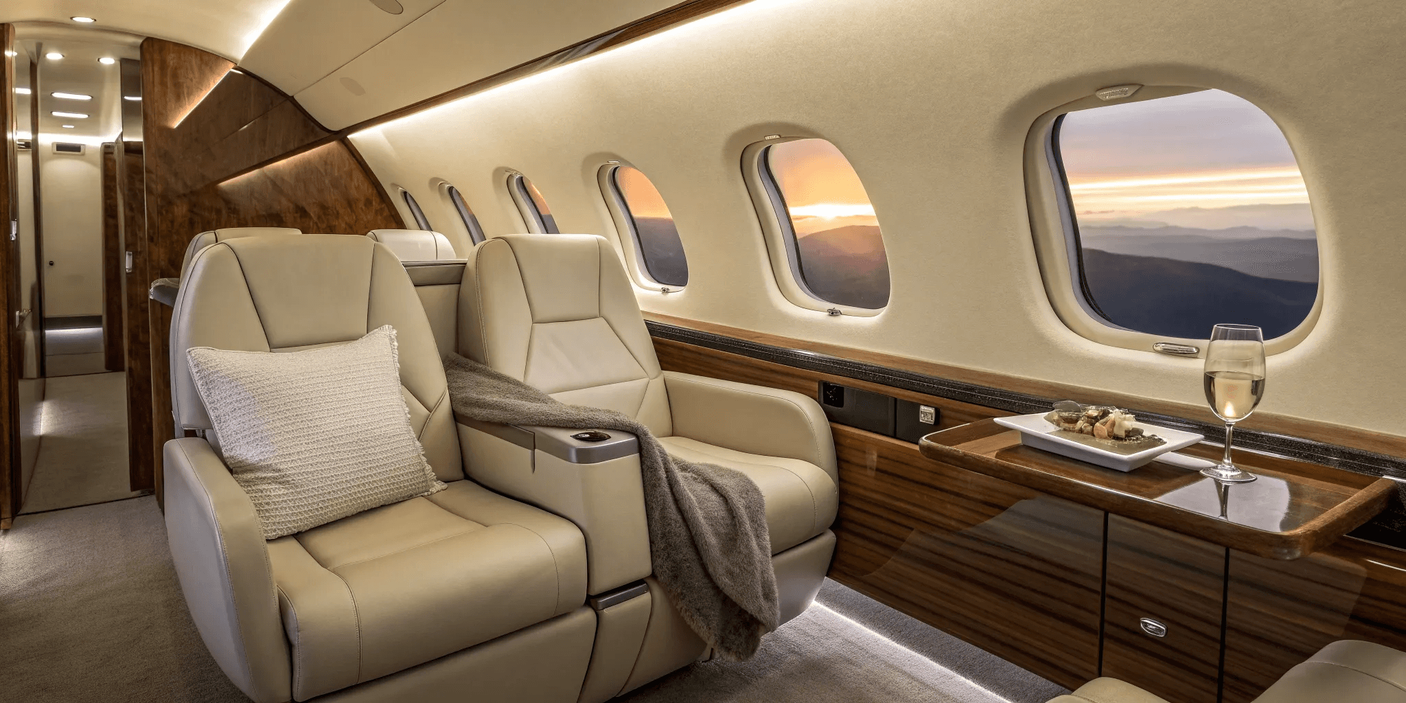 Luxury private jet parked on the runway beside a black executive car, representing premium private aviation and seamless travel service.