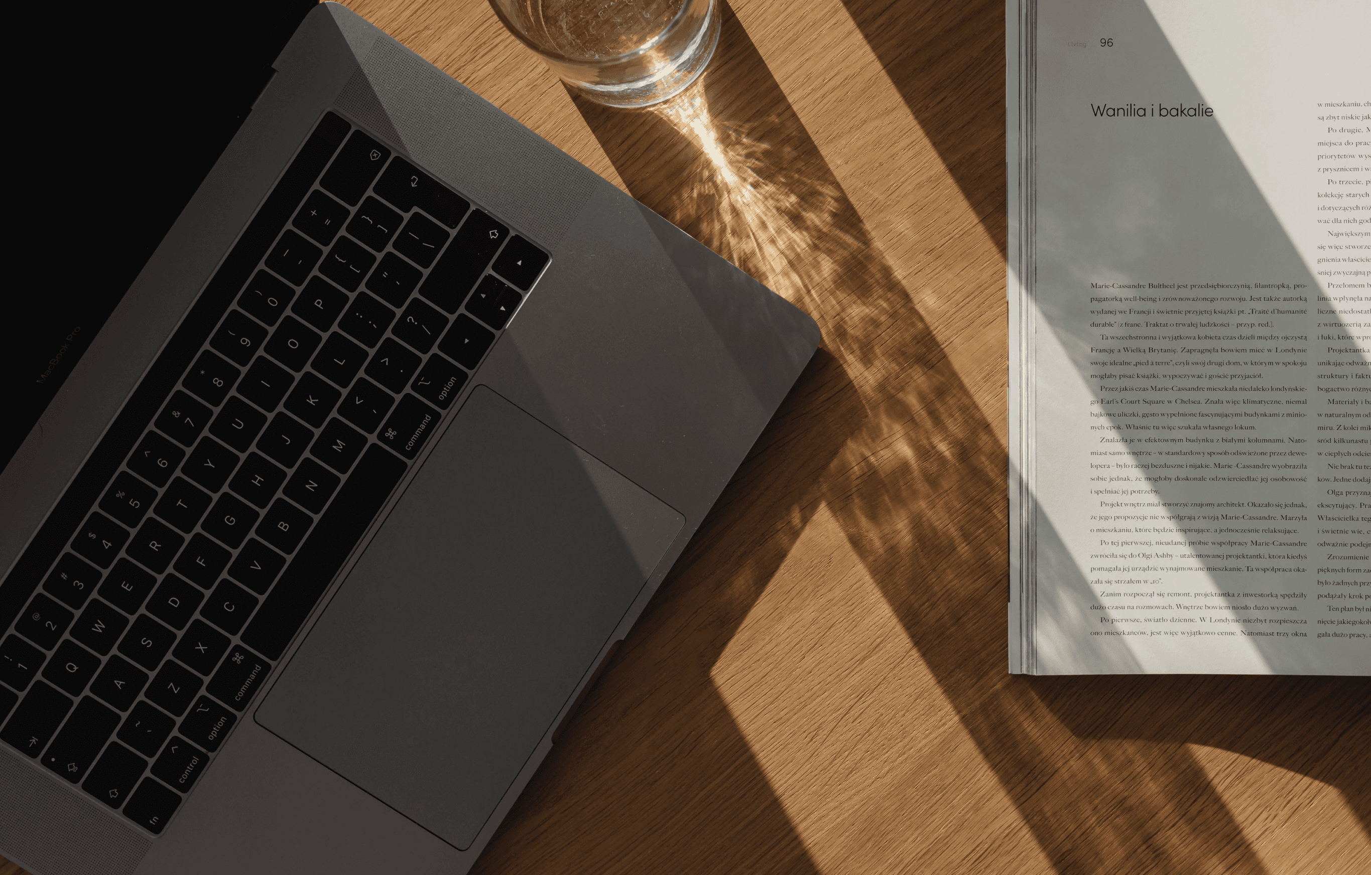 Laptop and book on a desk