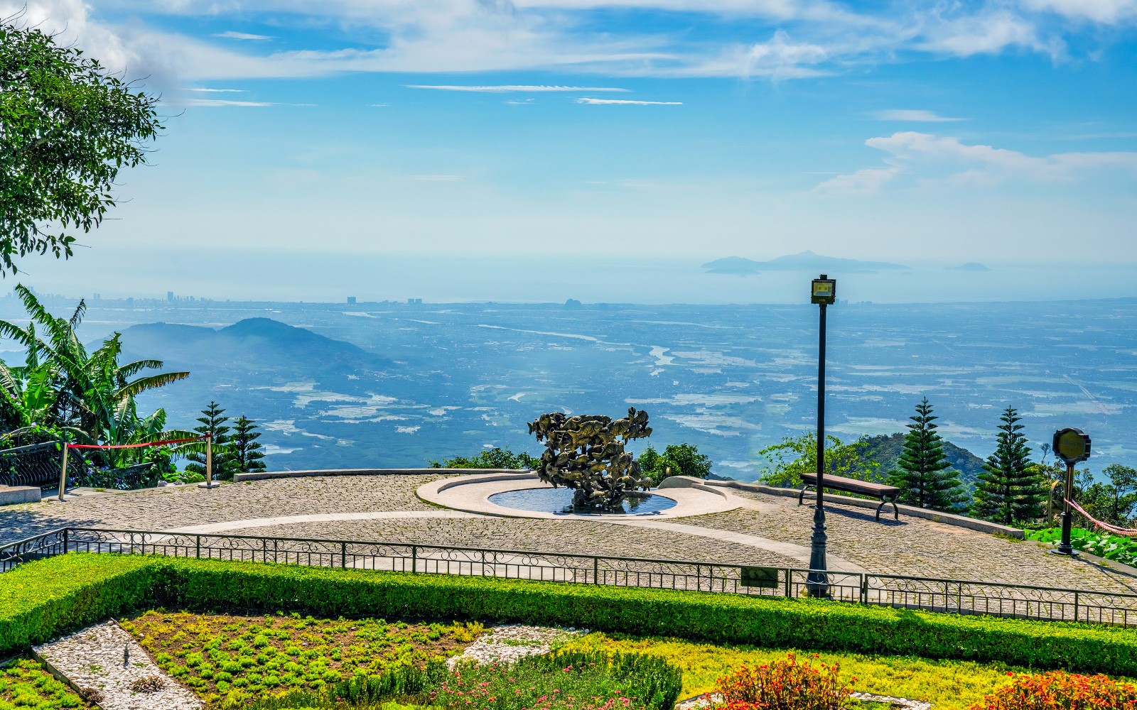 Sun World Ba Na Hills view with sculpture and distant landscape from cable car station.