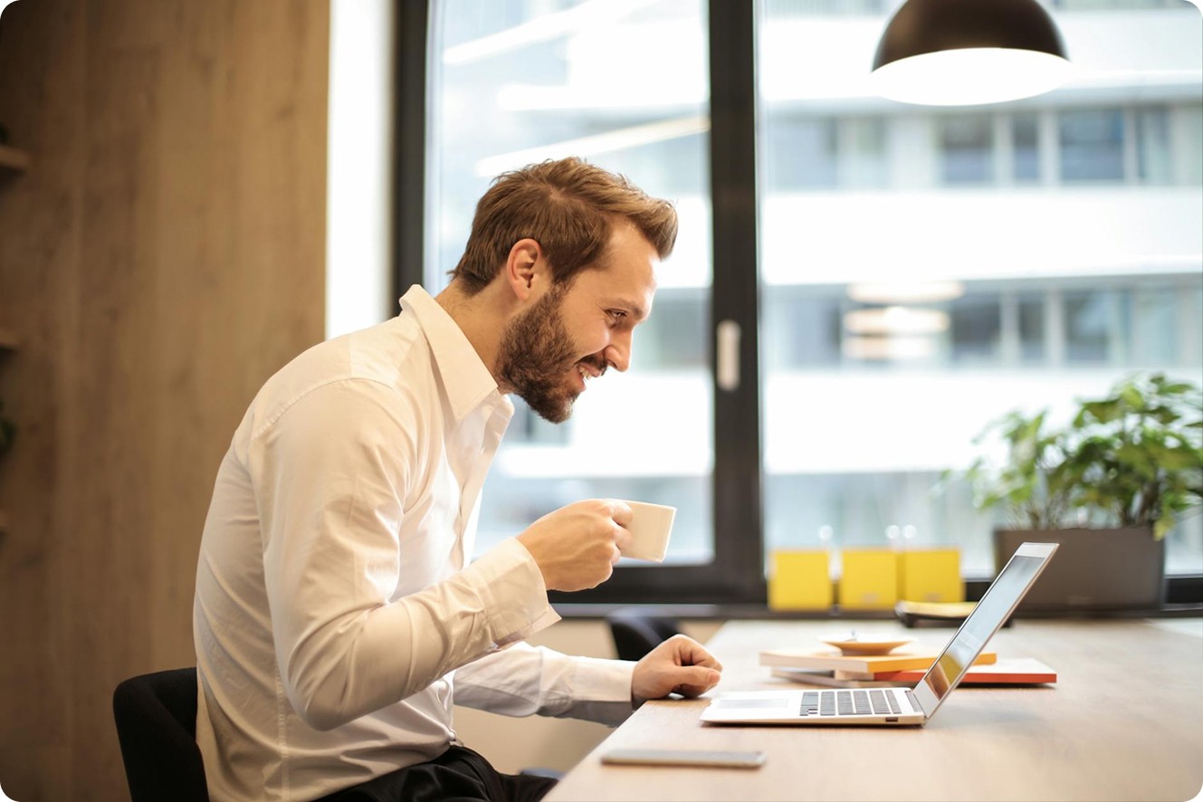 person sitting front of laptop