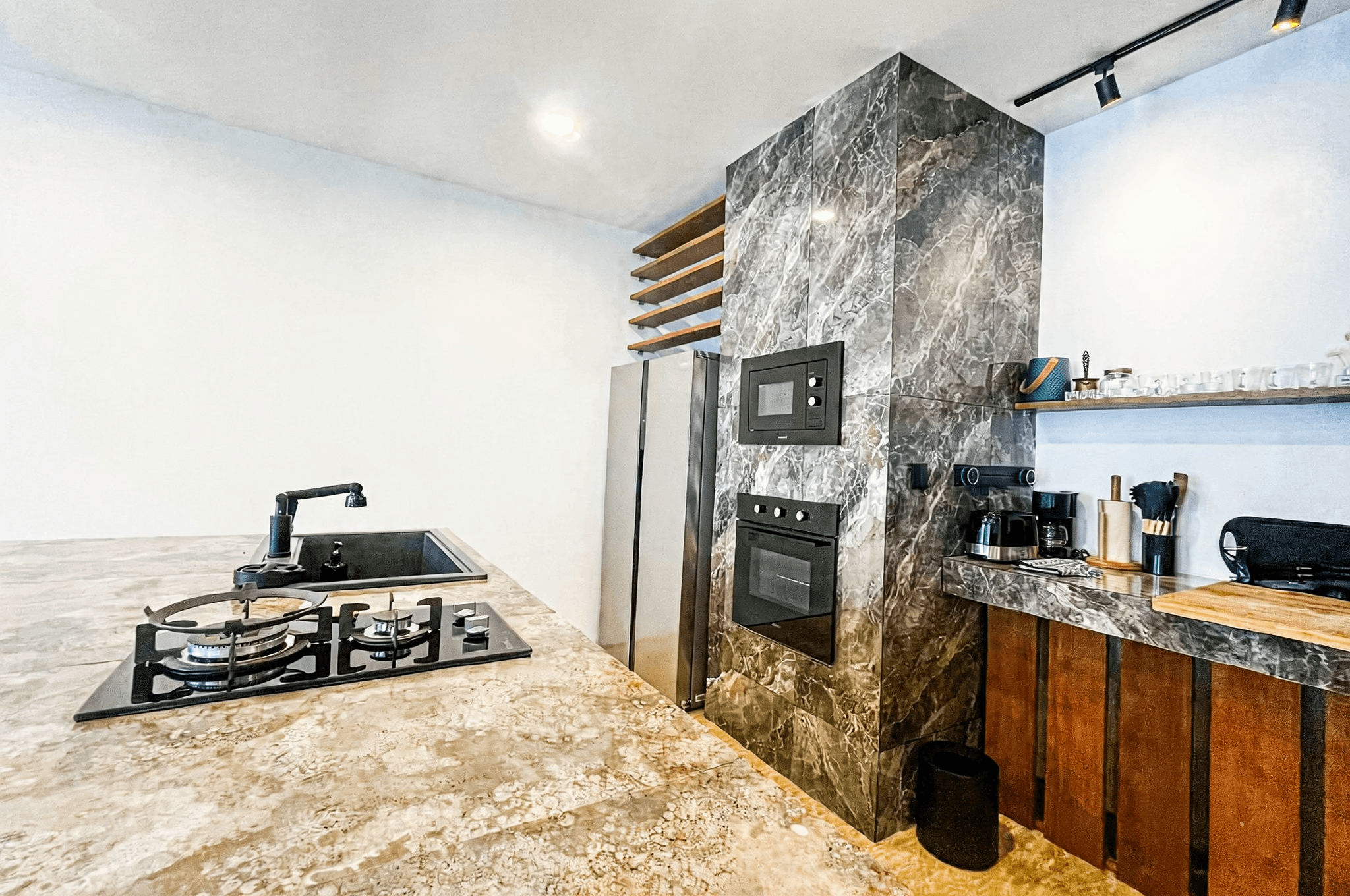 High-end marble kitchen design in Ungasan I residence, showcasing premium real estate features in Bali.