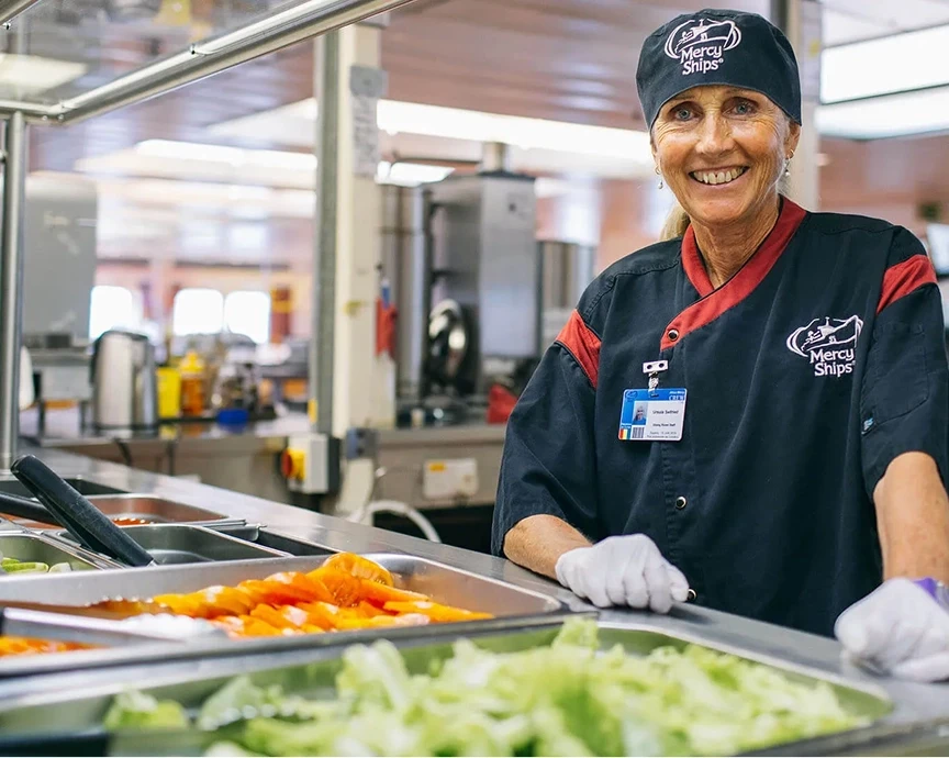 Woman serving in the cafeteria