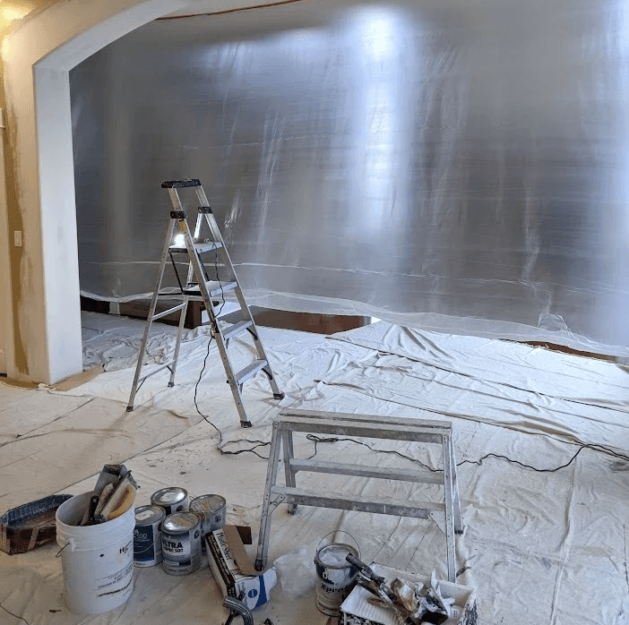 Jobsite with ladders and paint cans
