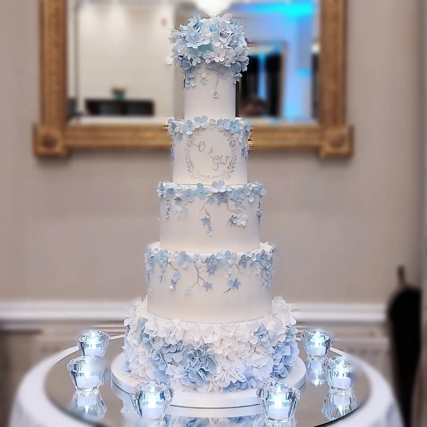Bespoke five tier blue blossom cascade wedding cake by Sherbert Moon
