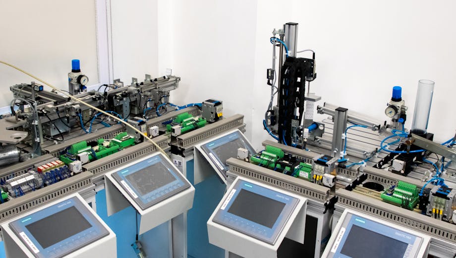High-tech industrial automation system with control panels indoors.