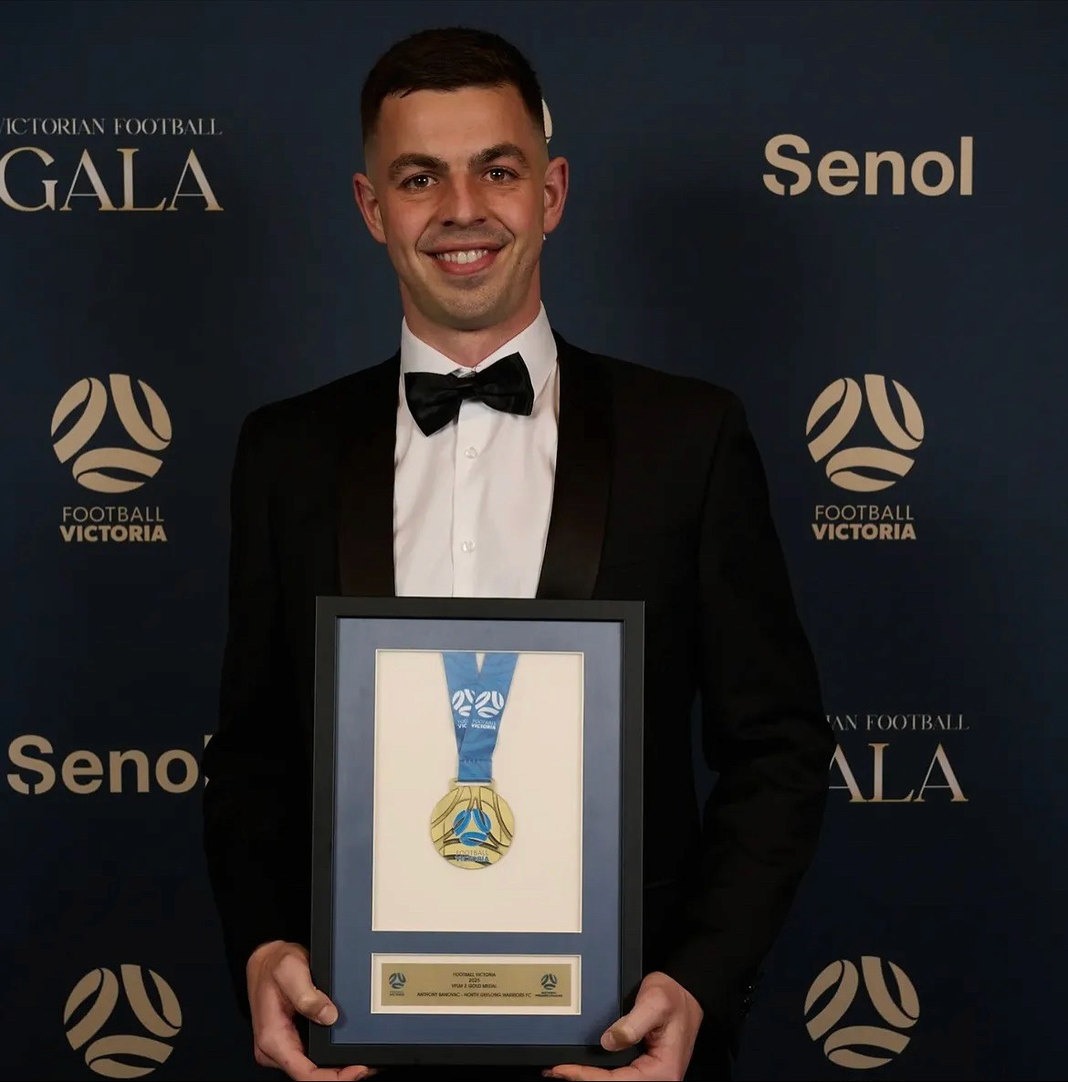 Geelong Warriors player, Anthony Banovac holding the 2025 VPL2 Player of the year award.