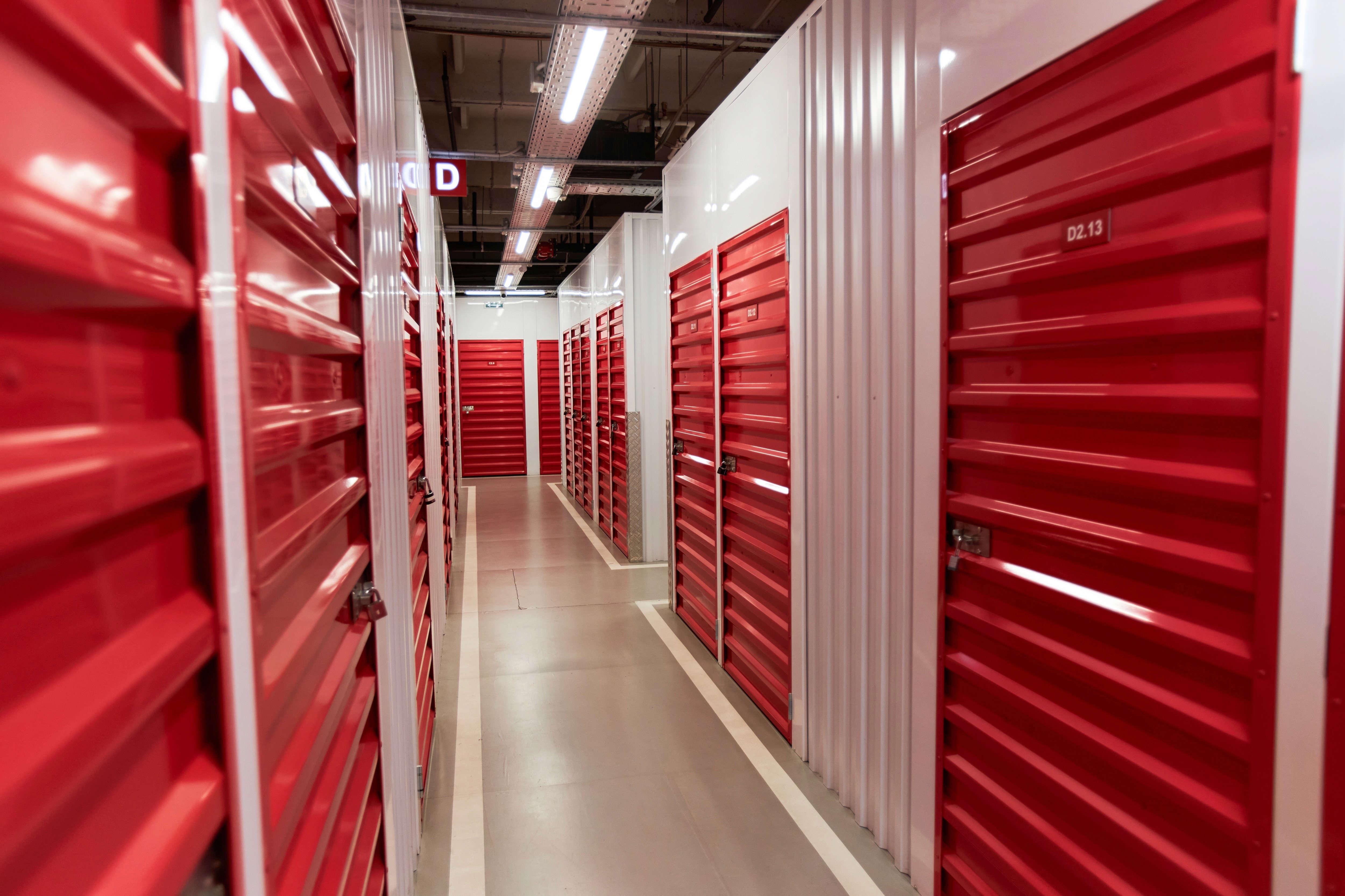 A climate controlled warehouse with red durable doors by ARENA Storage