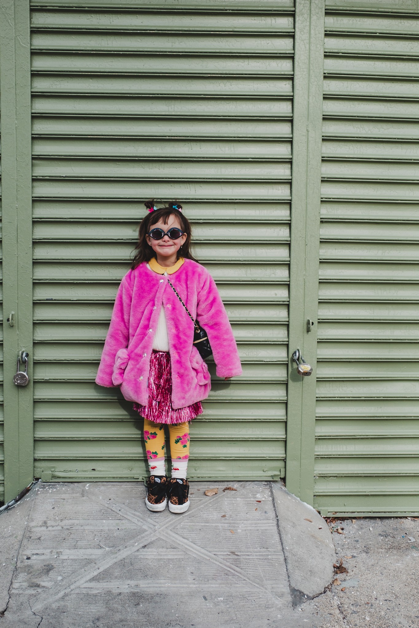 katt-jones-photography-expressive-young-girl-portrait-pink-fur-coat-nyc-green-wall