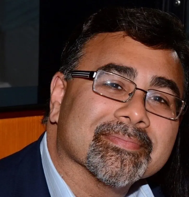 Man wearing glasses and a goatee
