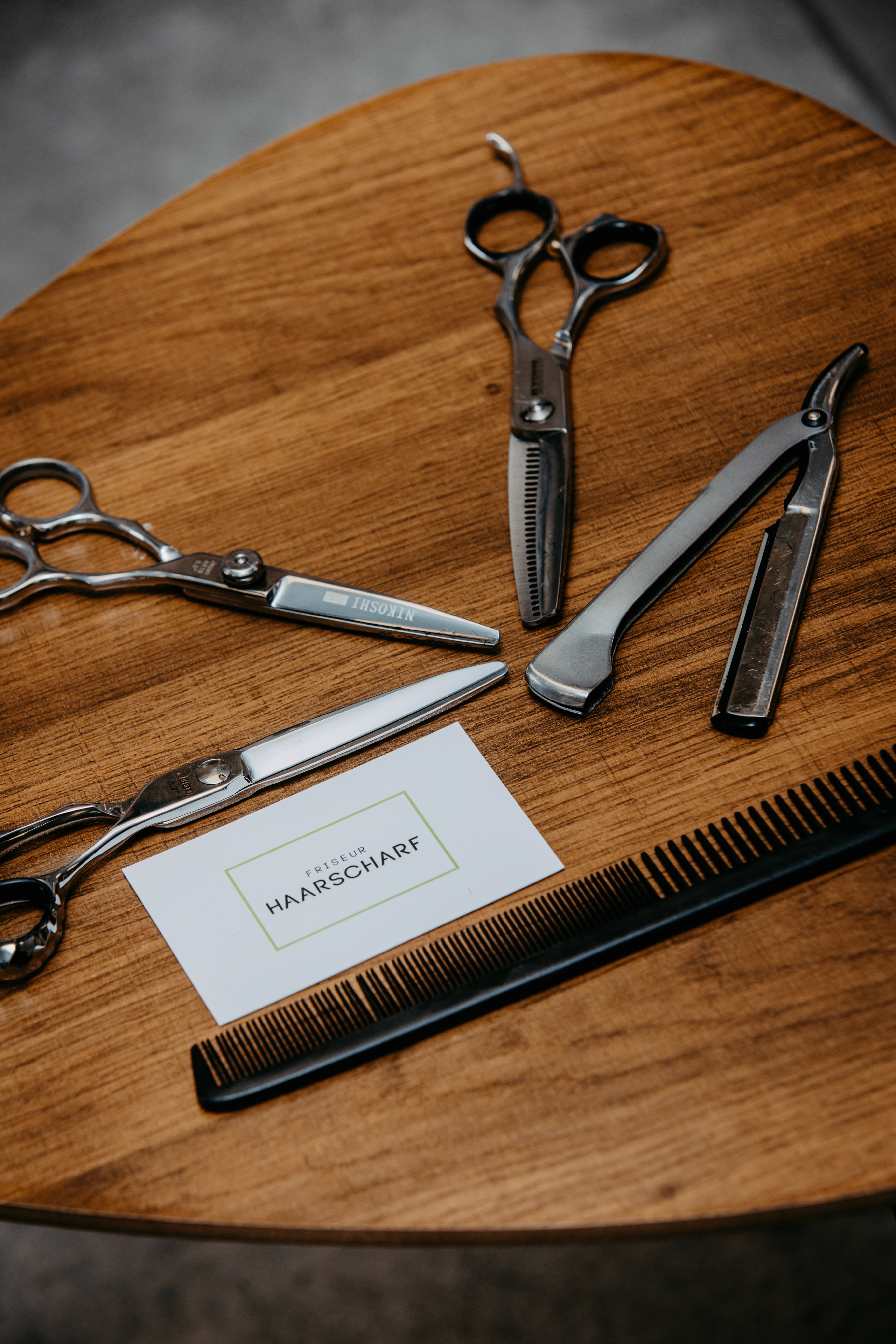 A girl with a beautiful smile stands at the reception in the Camelia beauty salon, awaiting visitors.