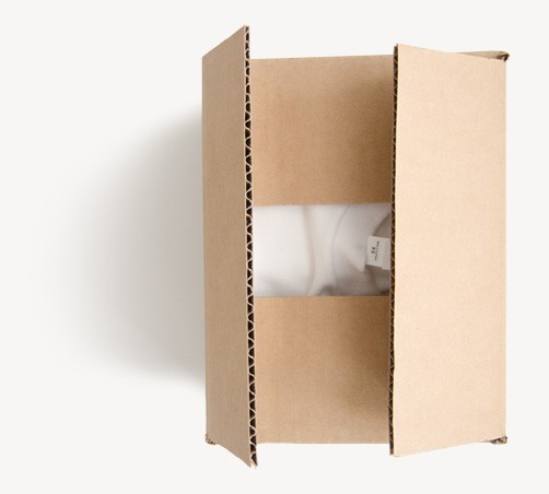 A cardboard box opened to reveal a white garment inside. The box is light brown and appears to be new.