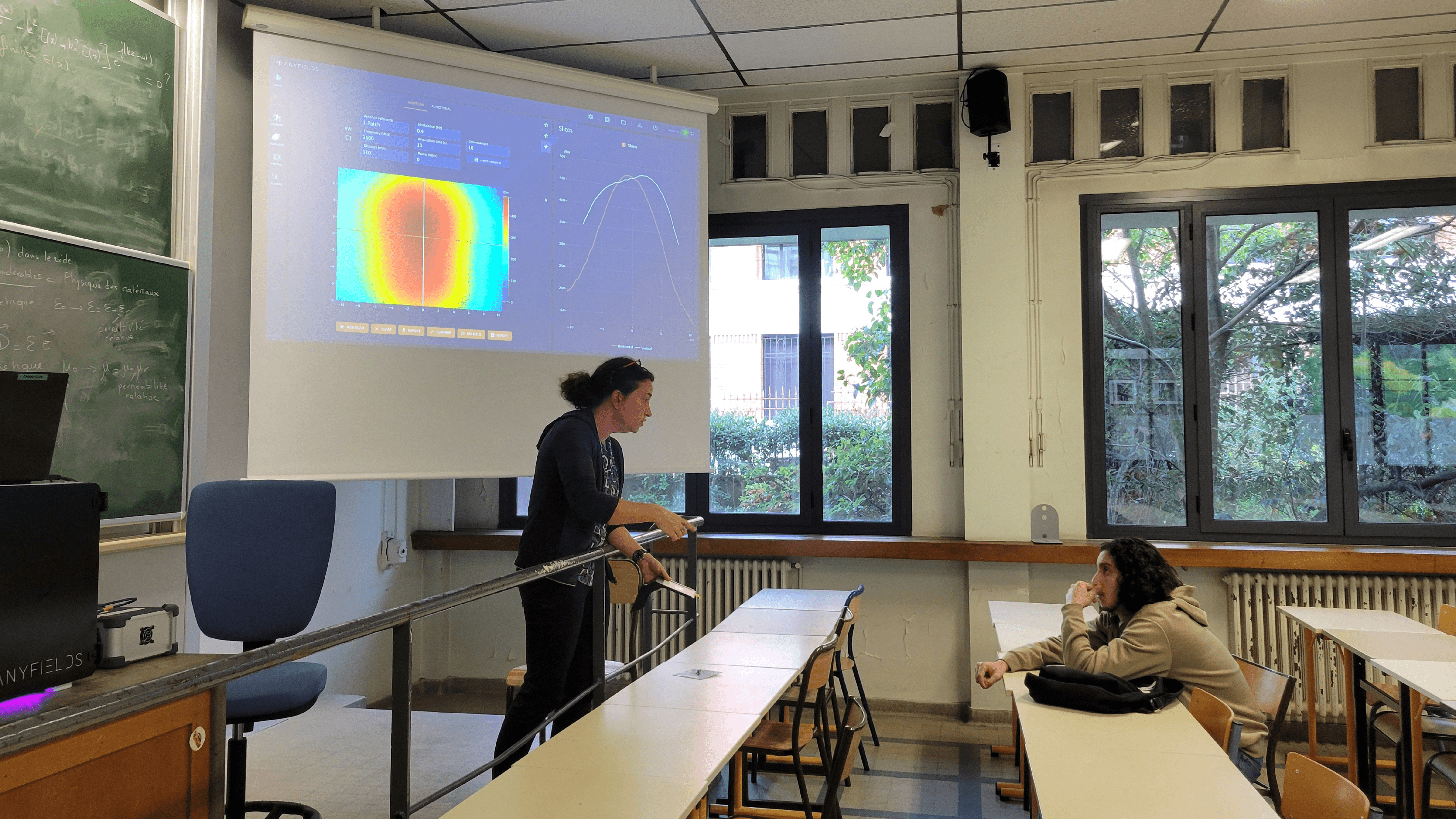 Professor explaining radiation pattern in front of a student