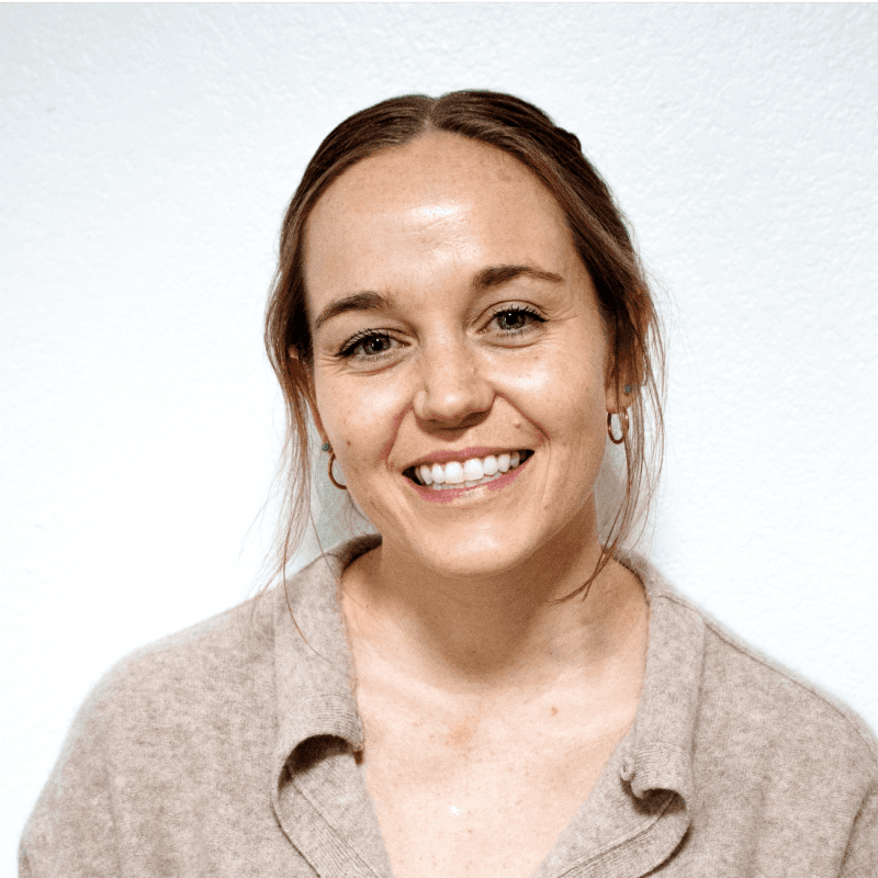 Visual designer in a minimalist studio with an iPad