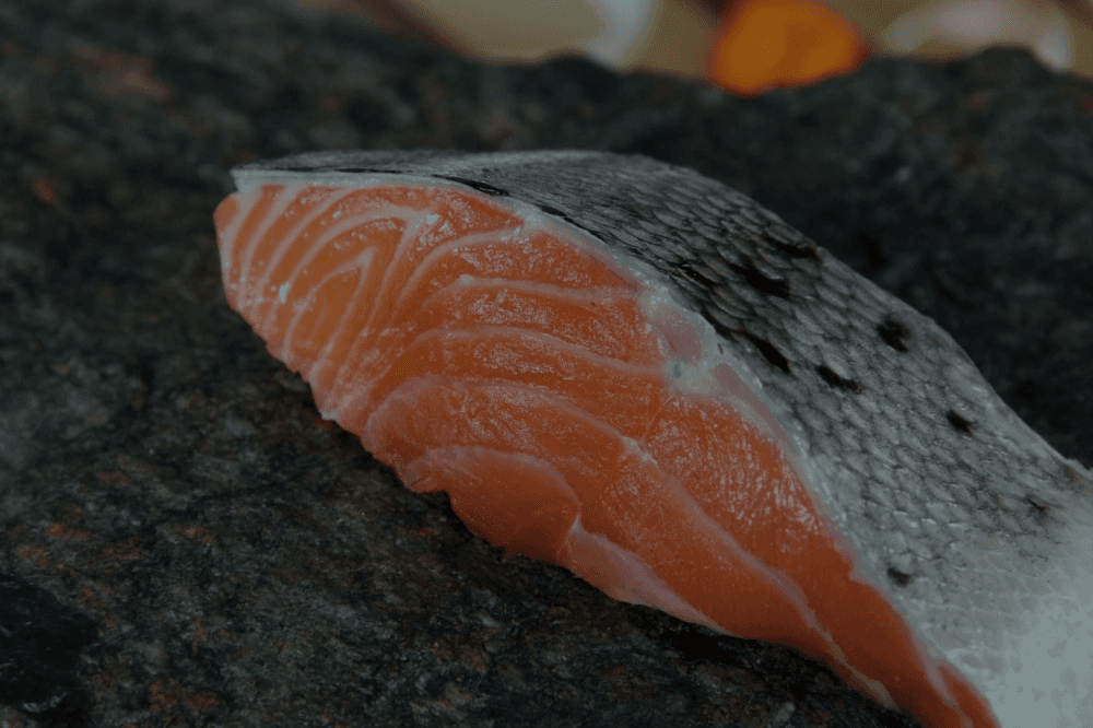 a close up of a piece of fish on a table