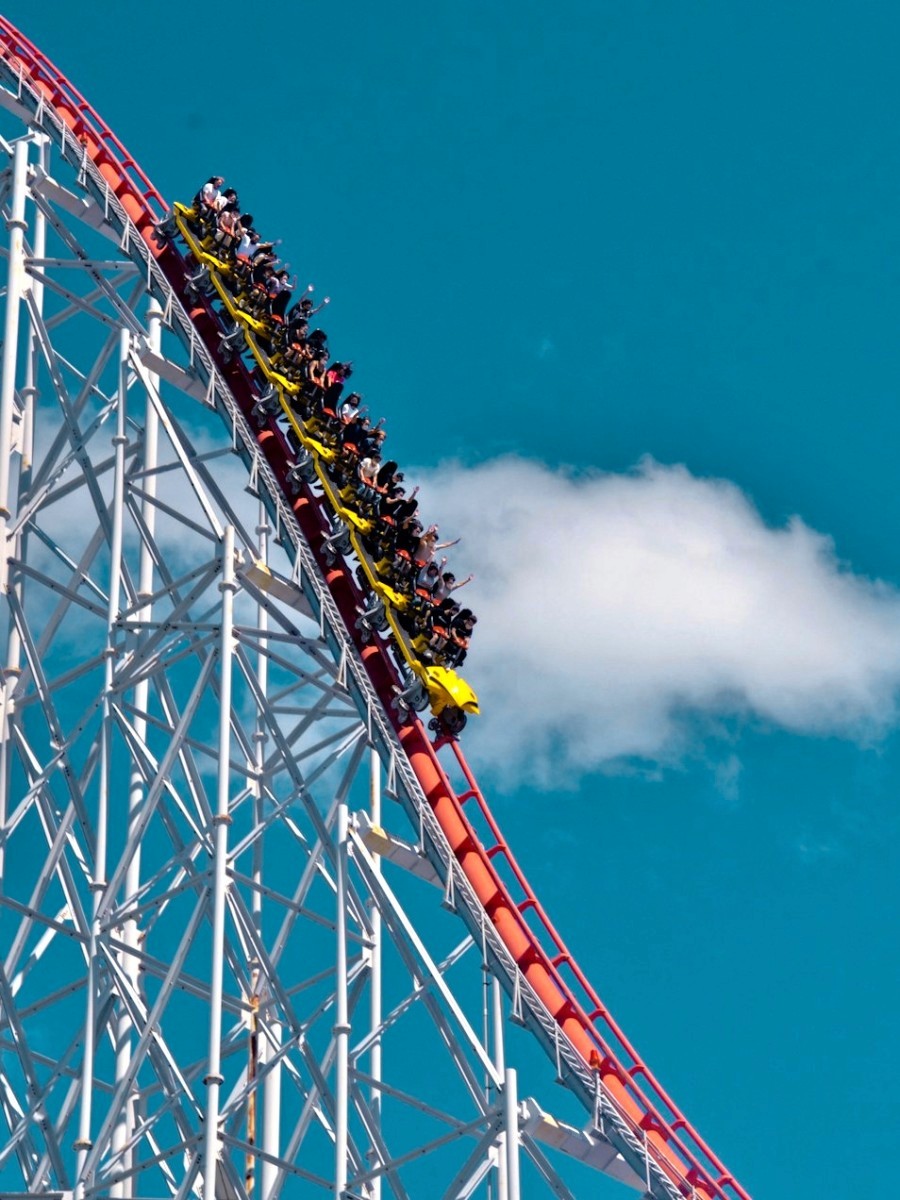 three brown wooden boat on blue lake water taken at daytime