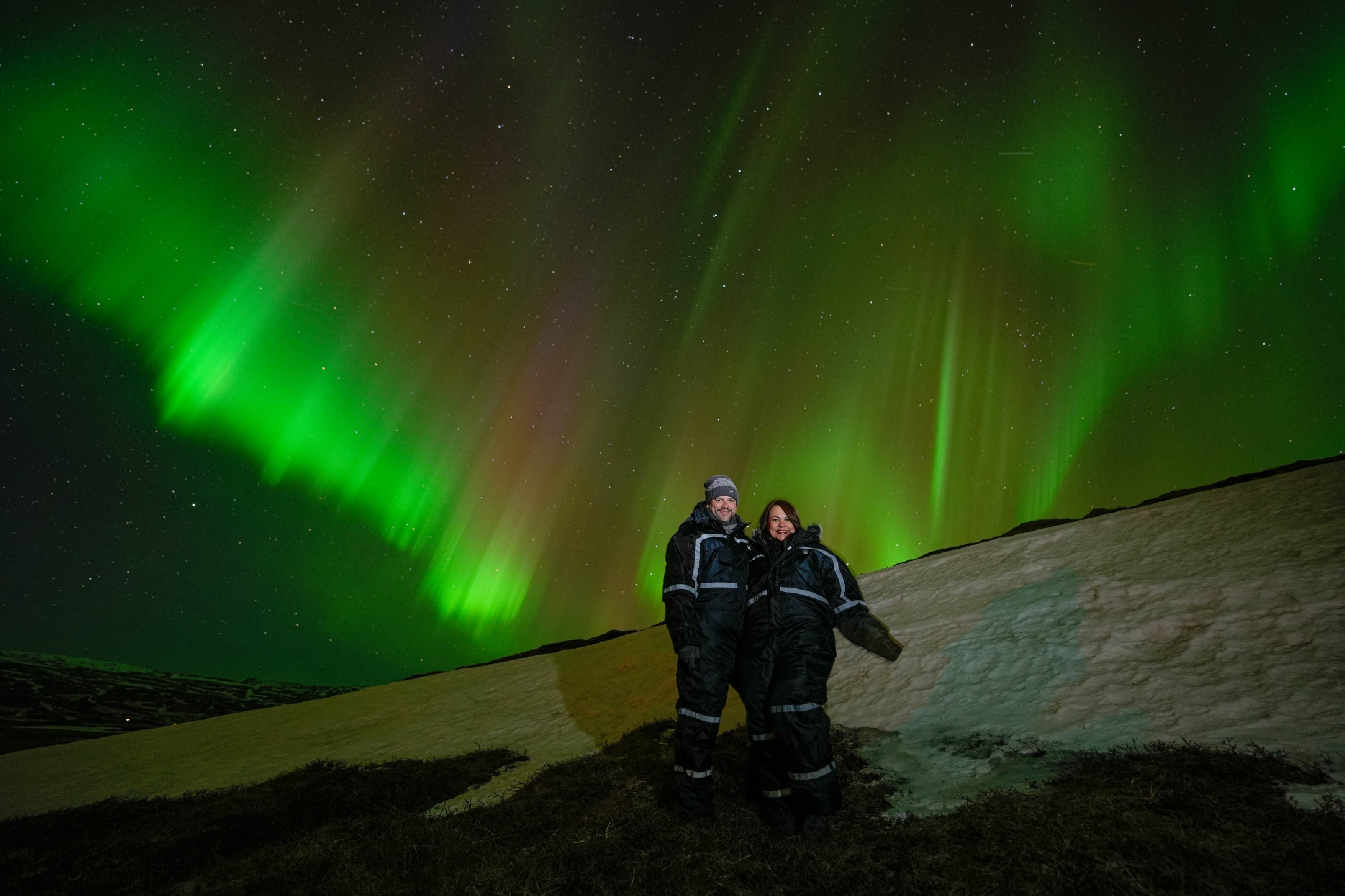 Northern Lights tour photography from Aurora Experts in Iceland, featuring guests beneath the aurora, winter landscapes, and vivid skies over remote Icelandic locations.