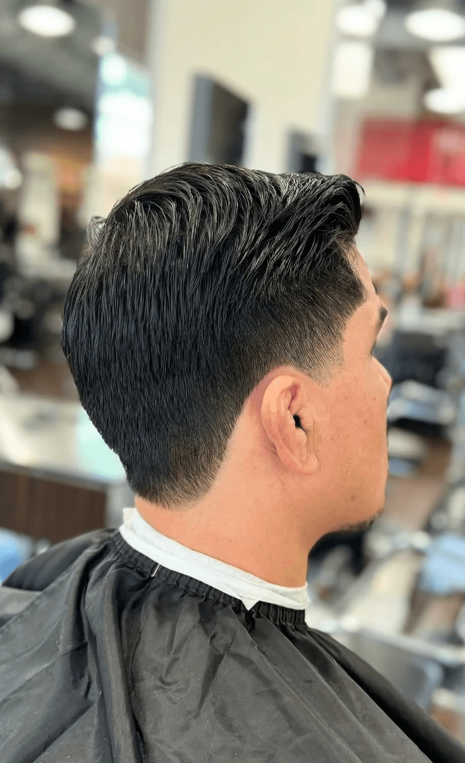 Textured brunet cut with a neat finish, suitable for professional and casual looks.