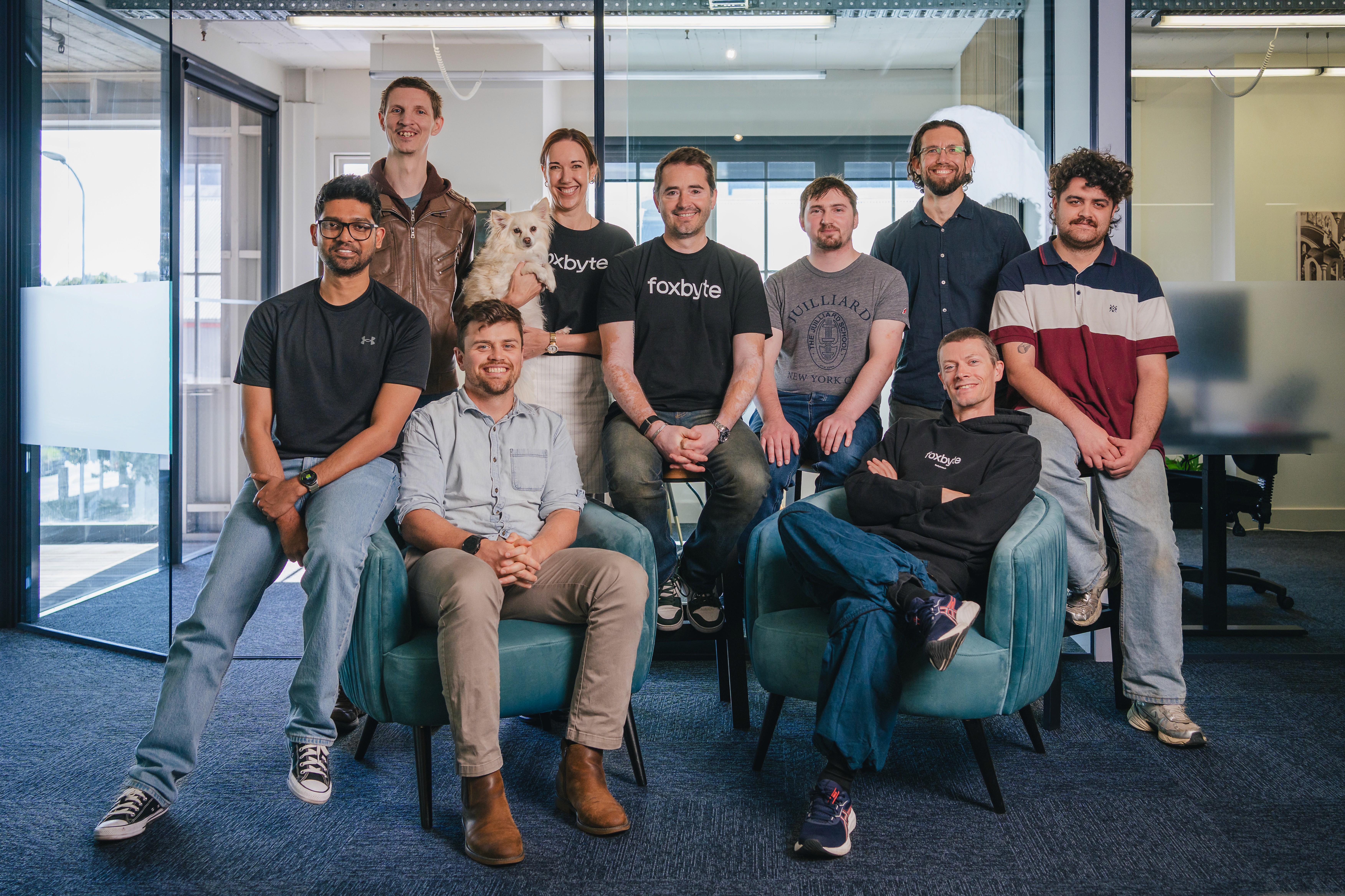 The Webfox team standing together at their Napier office – experts in AI, software development, and digital solutions.