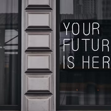 a window with a sign that says your future is here