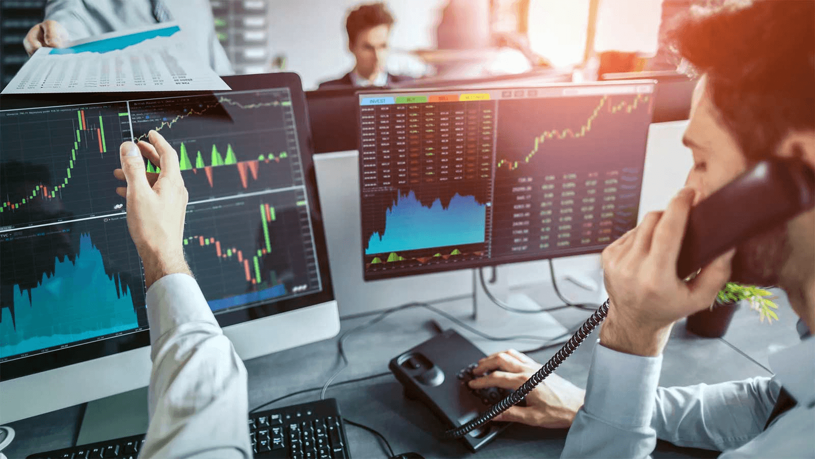 Traders analyzing real-time market data - How to Invest in Prediction Markets