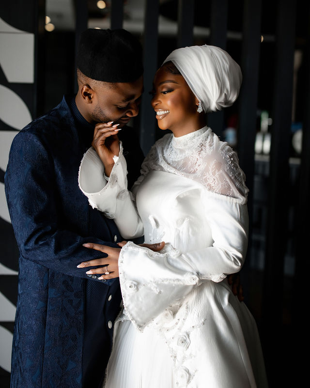 Groom in blue suit and Bride in white dress