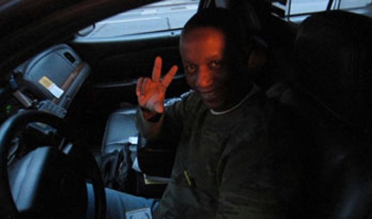 portrait of a taxi driver on the driver's seat