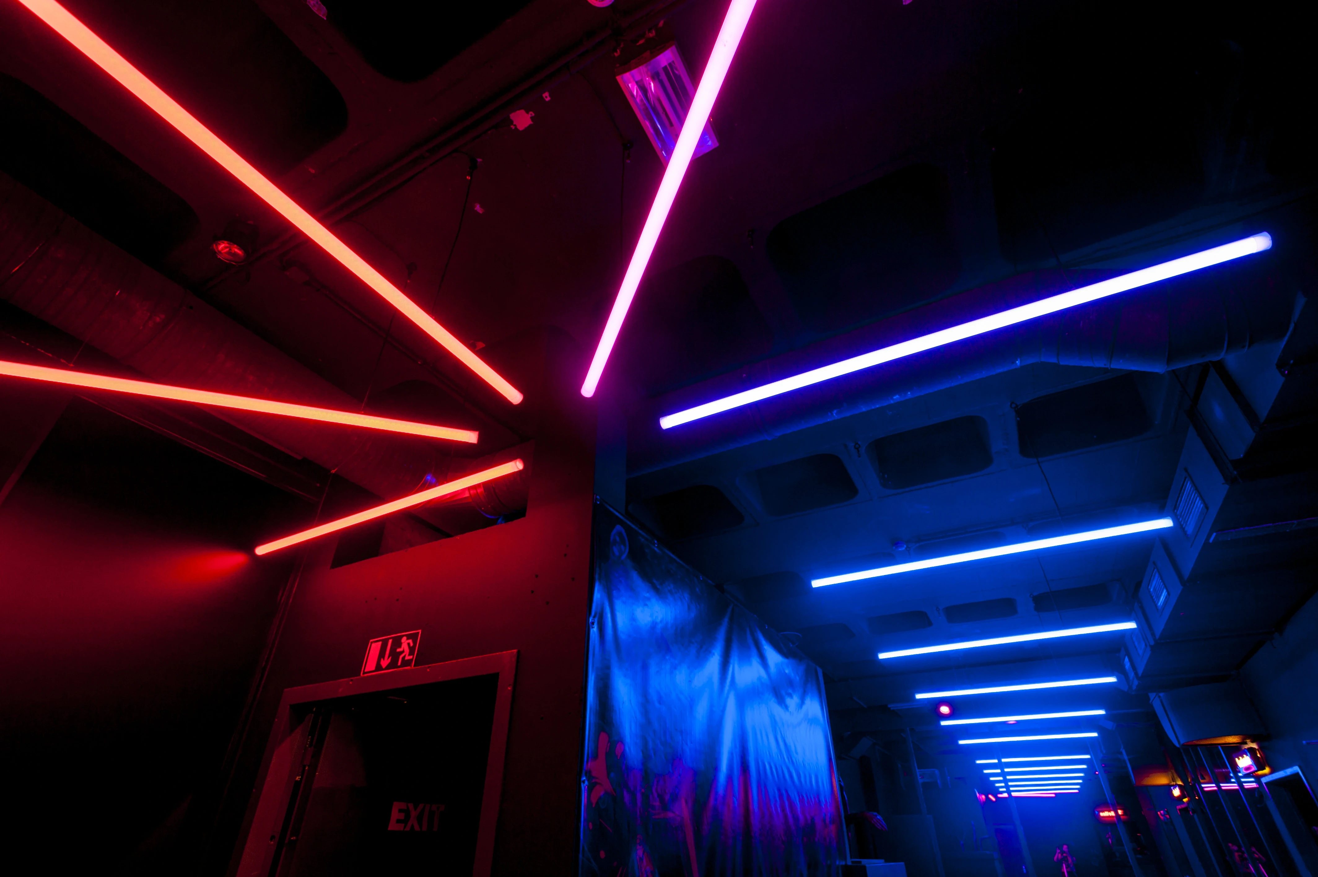 Red and blue neon light lines along the ceiling marking different zones of the Jägermeister Night Embassy.