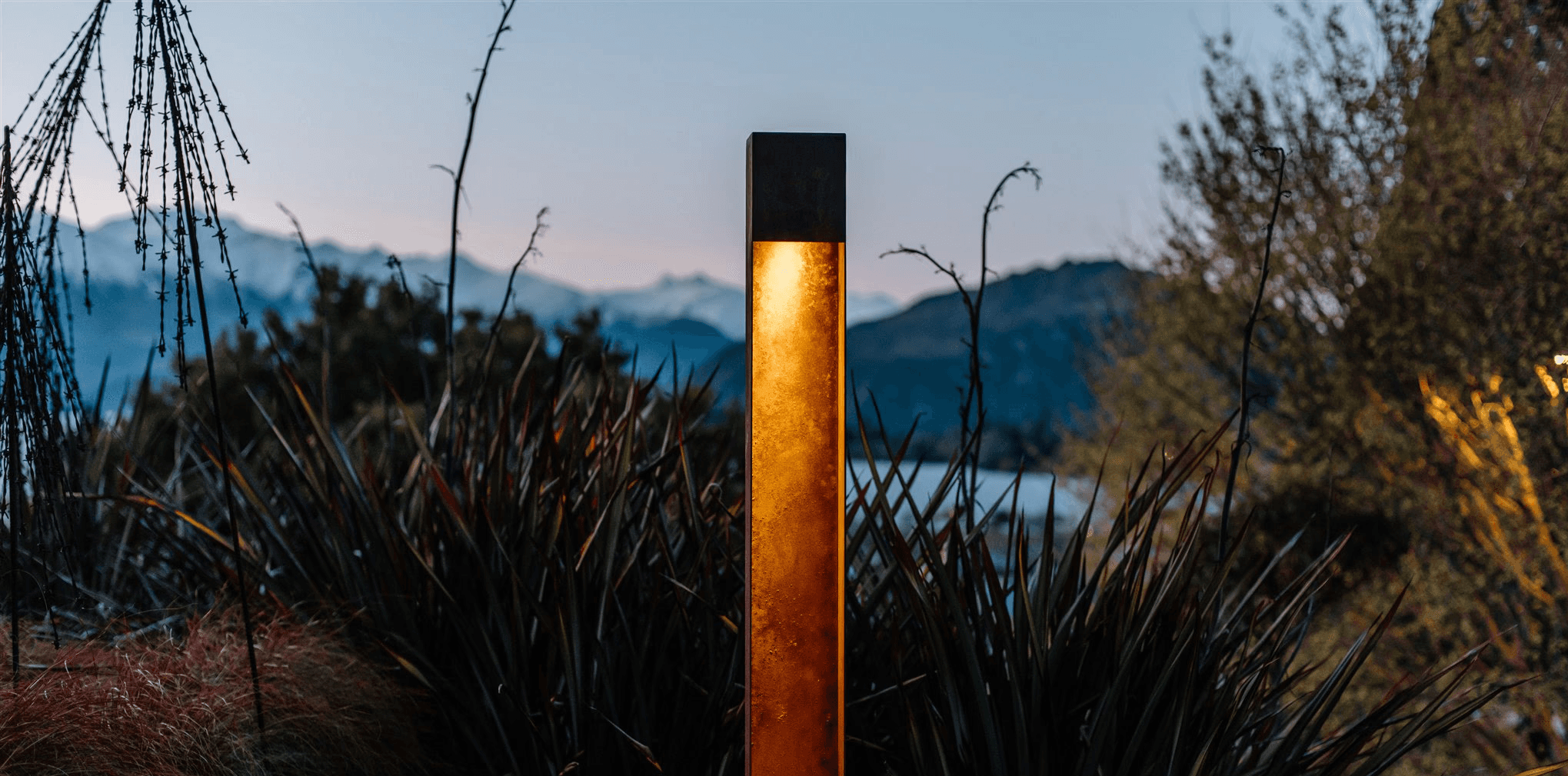 A visitor photographing a painting in an art gallery