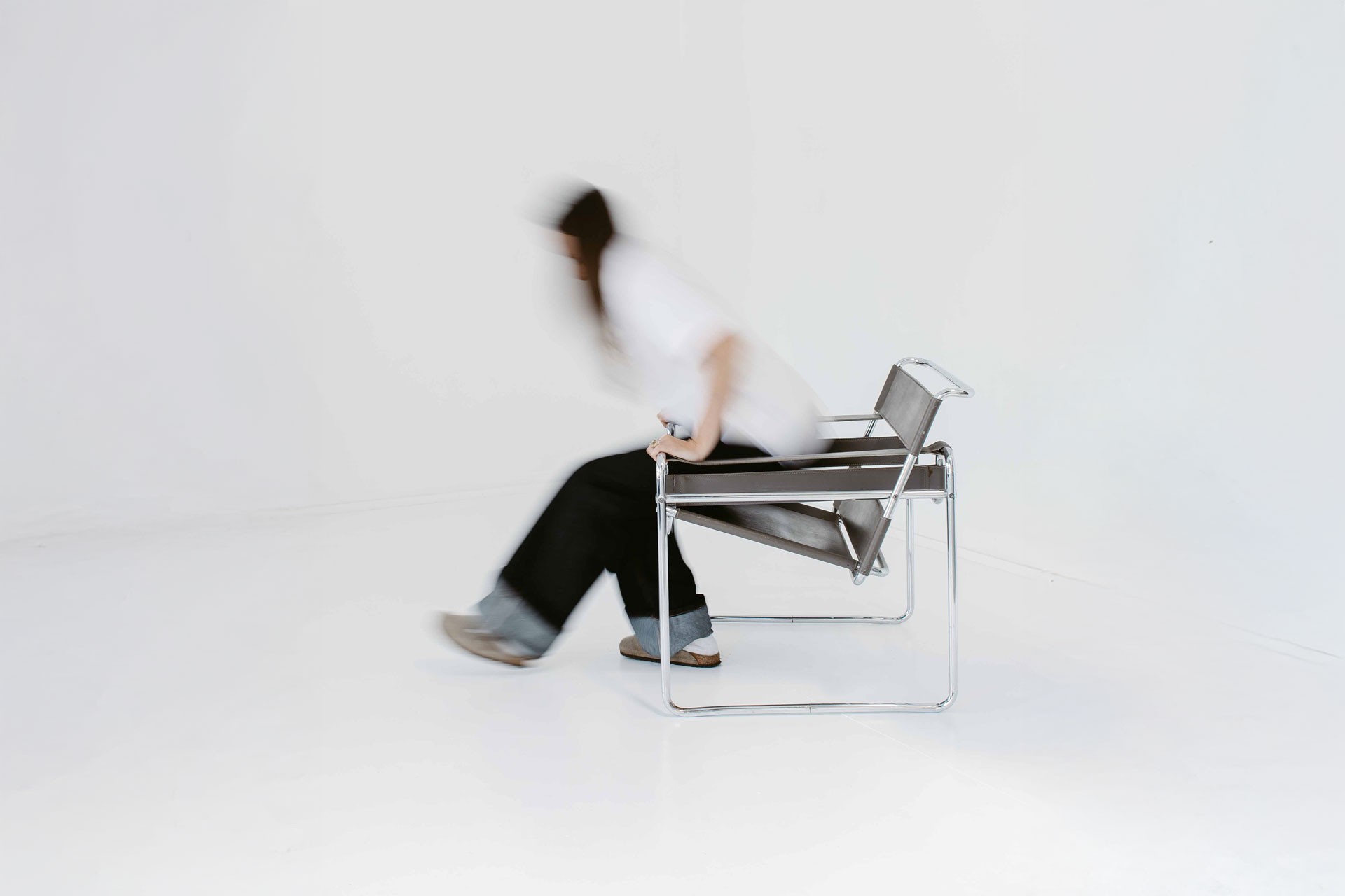 Alice climbing out of a chair