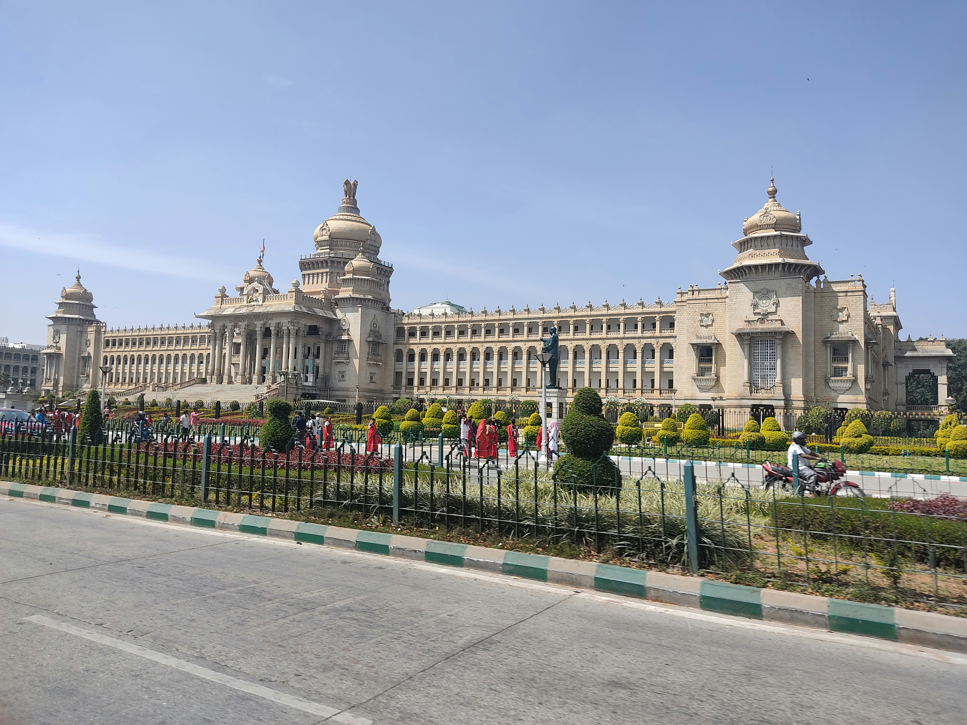 a large building with a fence in front of it