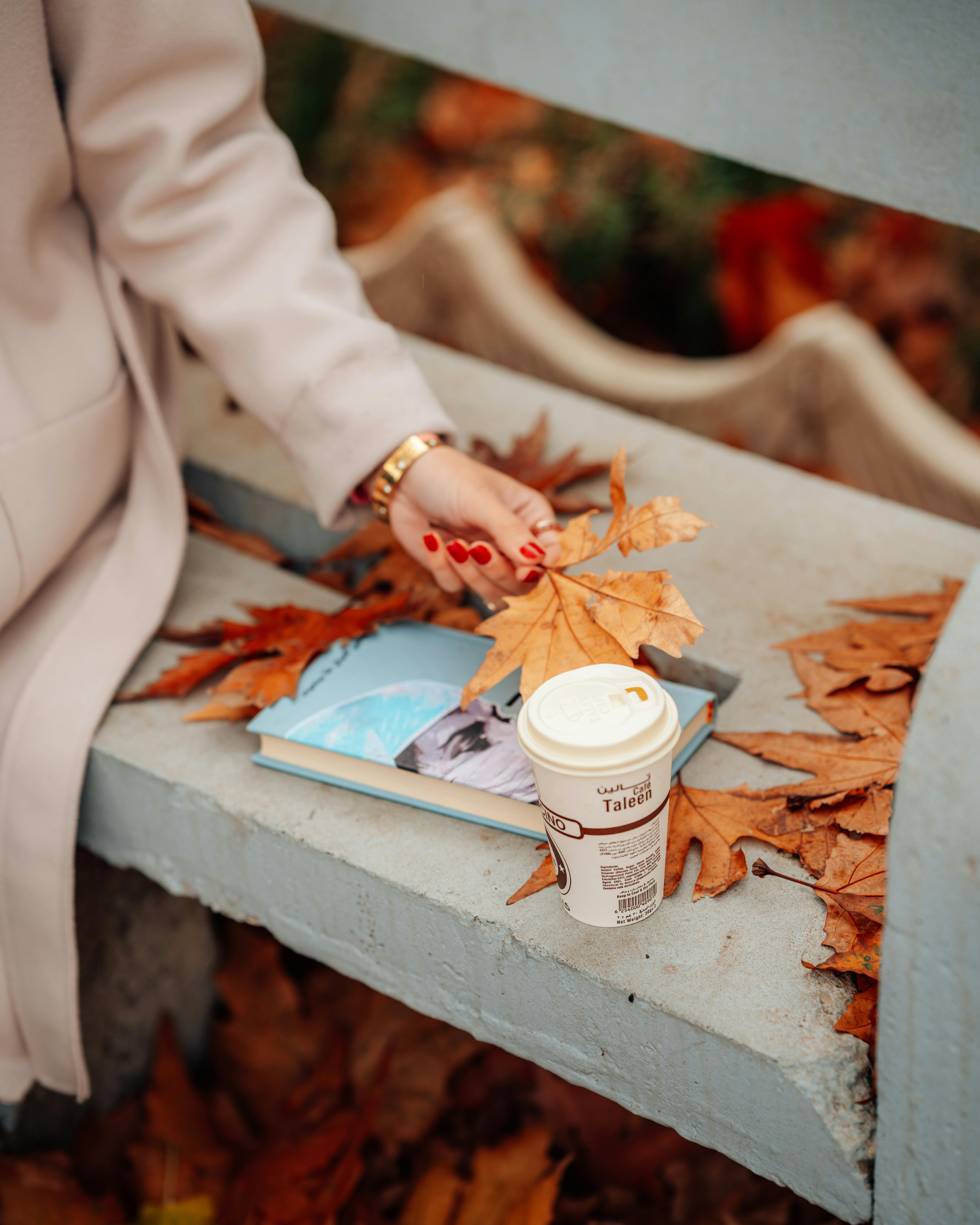 her way agency article about donating eggs during the cooler months with fall leaves and woman with red nail polish