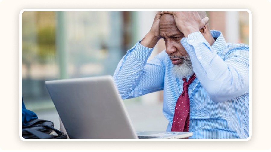 Stressed man in front of his computer