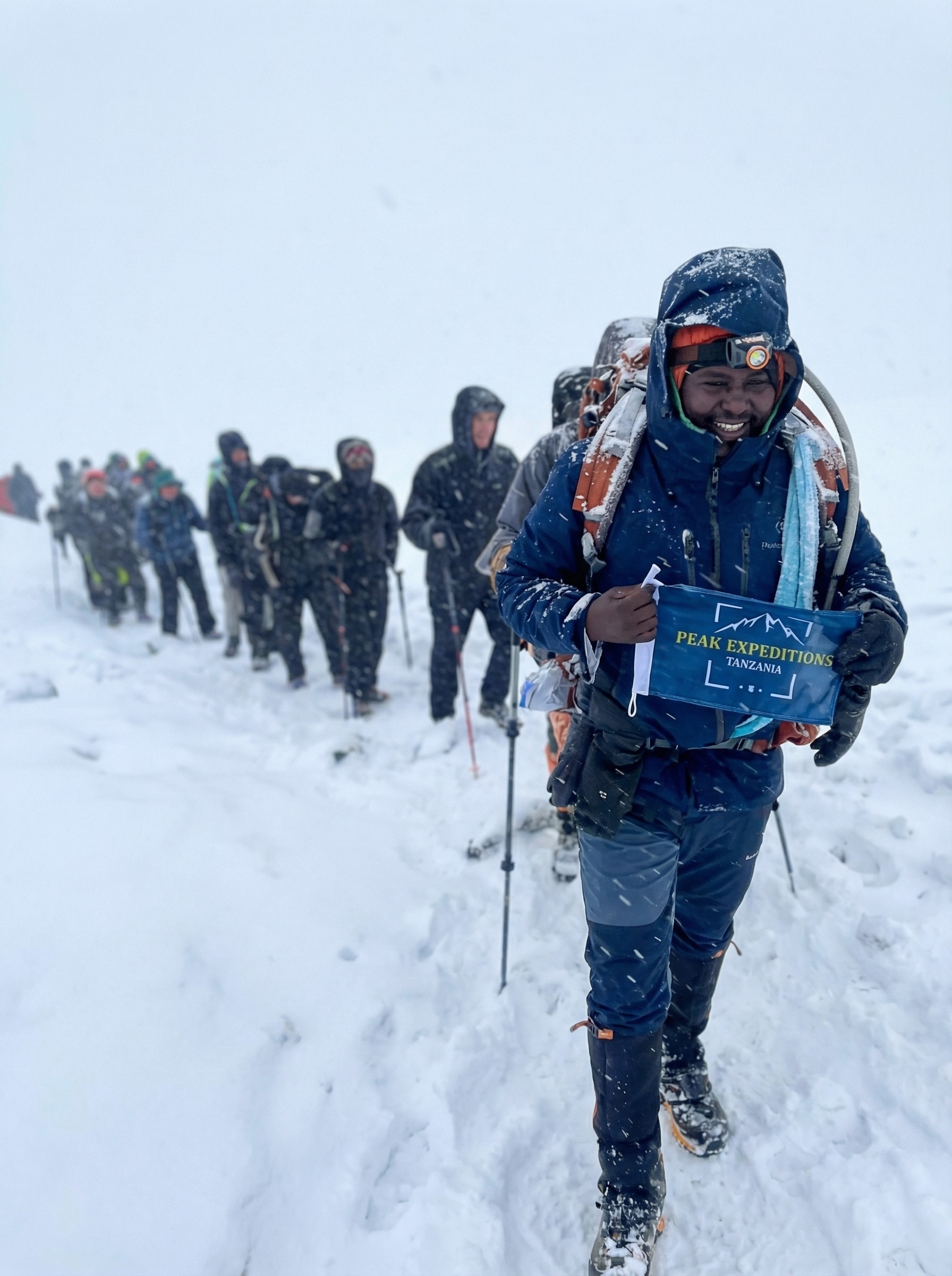 Traditional Arabic setup with chairs and lanterns in the desert sands of AlUla during sunrise.