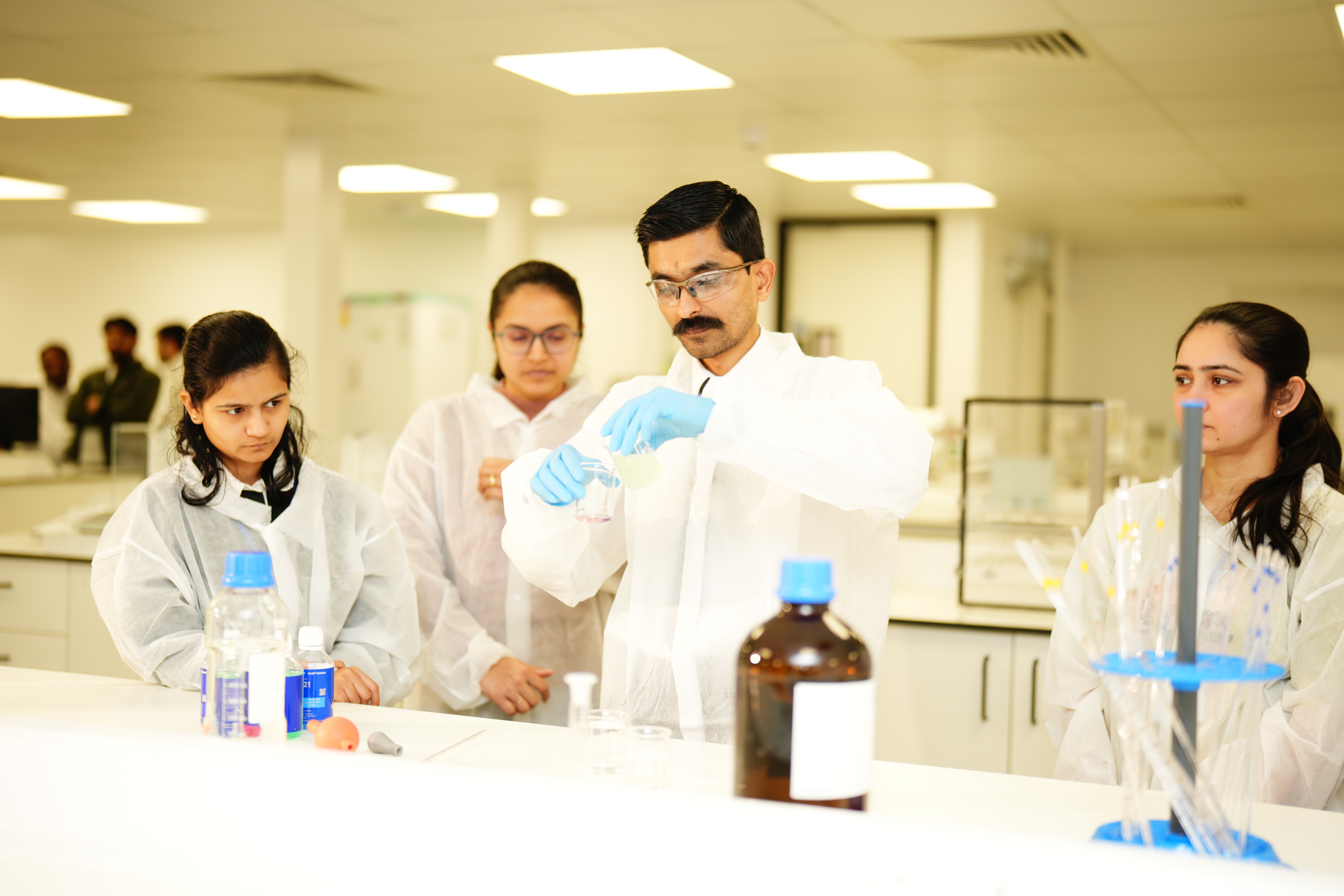 a group of children sitting on steps in front of a building