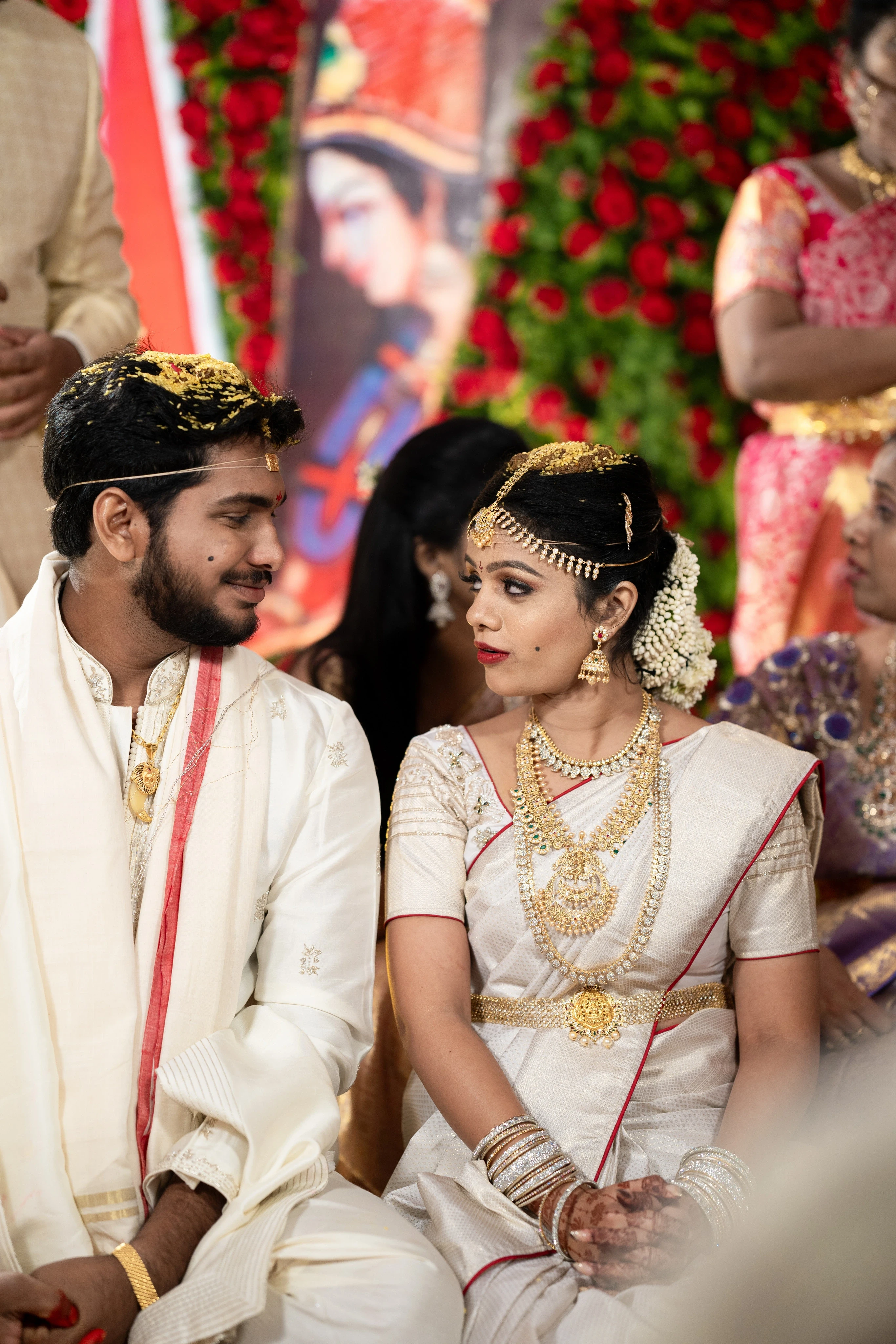 Fine Art Wedding Photography in Hyderabad by Out of The Blues – Rohit gazing lovingly into Lovely's eyes, capturing a beautiful and intimate wedding moment.