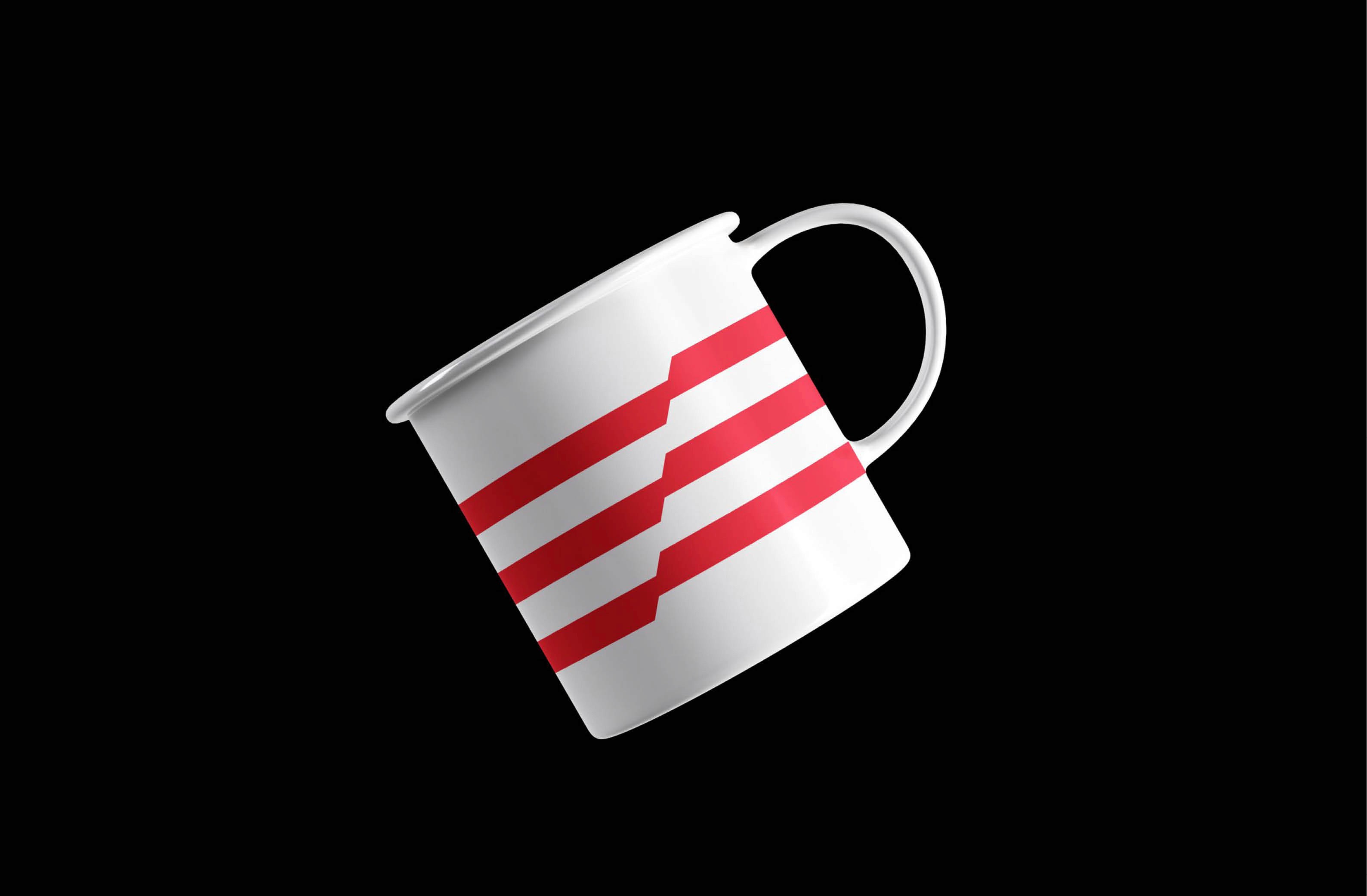 Stylish white mug with red striped design on a black background.
