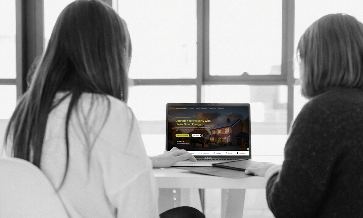 Man Holding Buy/Sell Signs