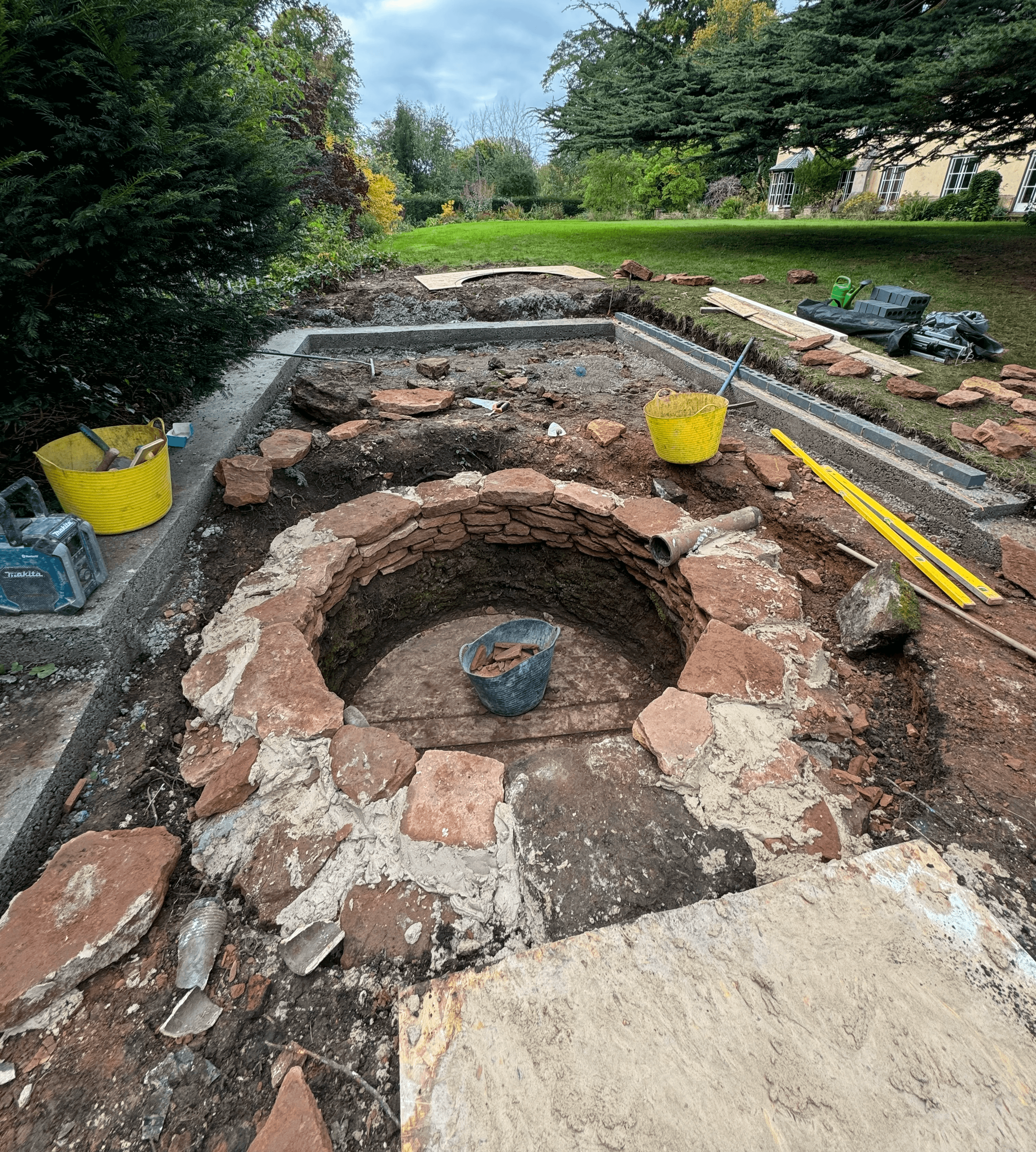 Using a circular board we plummed up the freshly quarried stone to a perfect circle.