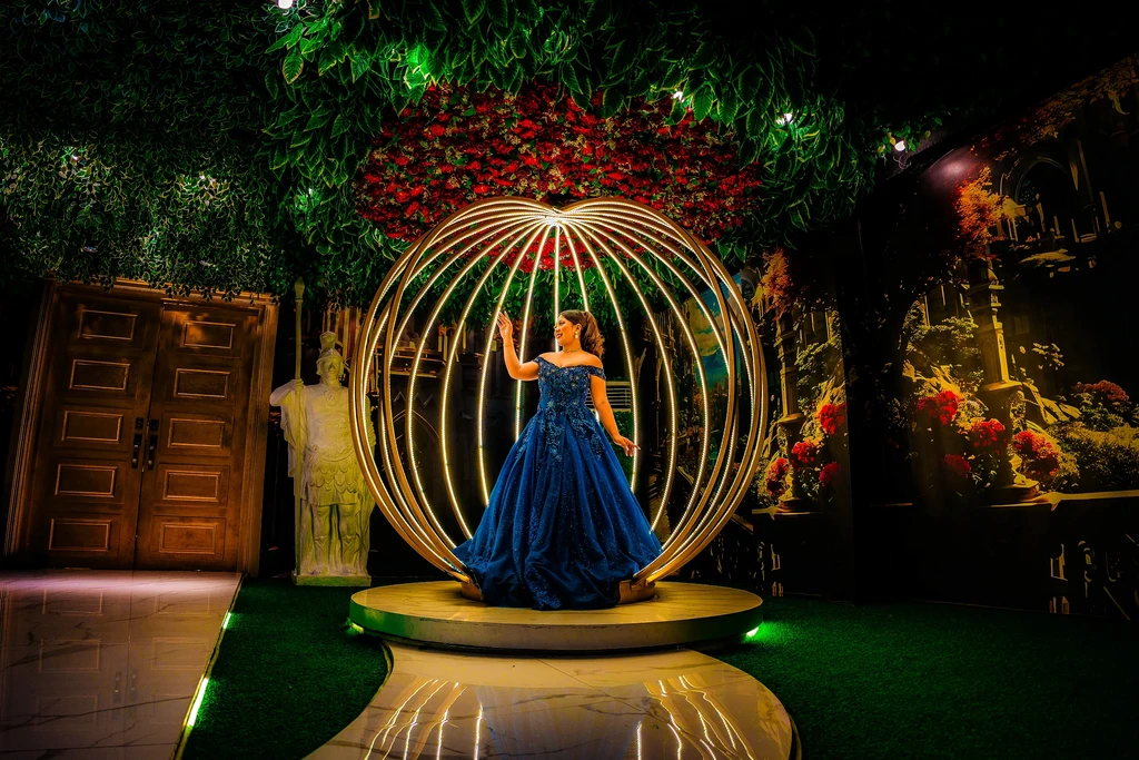Debutante reaching up inside the golden sphere at Pandora Hall, Quezon City