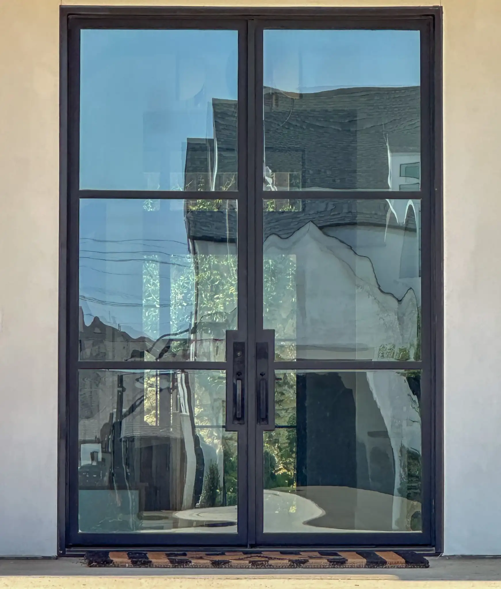 3 lite low profile iron double doors installed by M2 Metals Iron Doors DFW