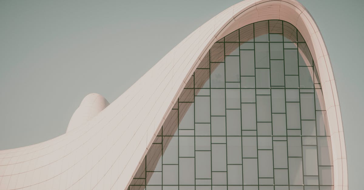 Futuristic curved building with modern glass design, showcasing innovative architectural elements.