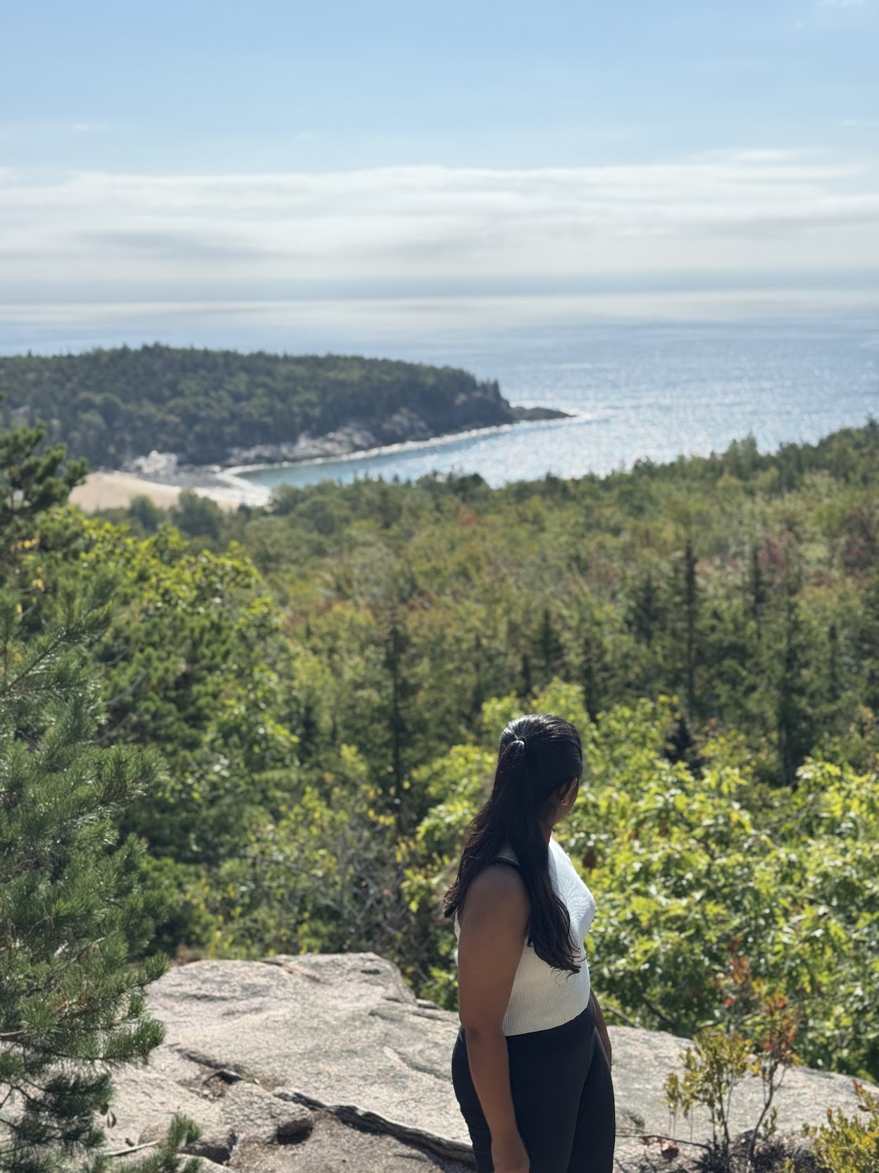 a group of people walking on a sidewalk