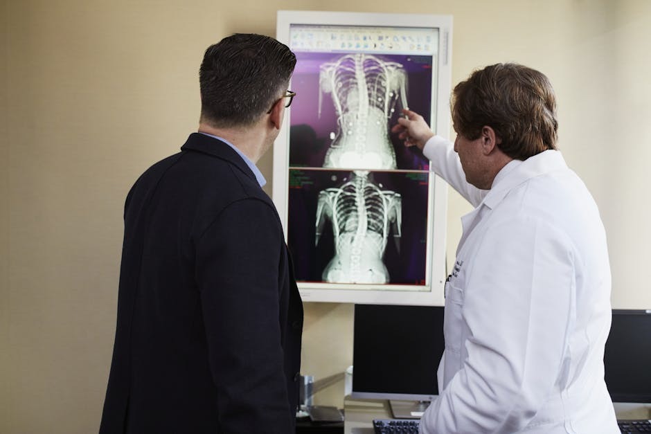 A clinician or educator pointing to a health chart or diagram while explaining a biological process.