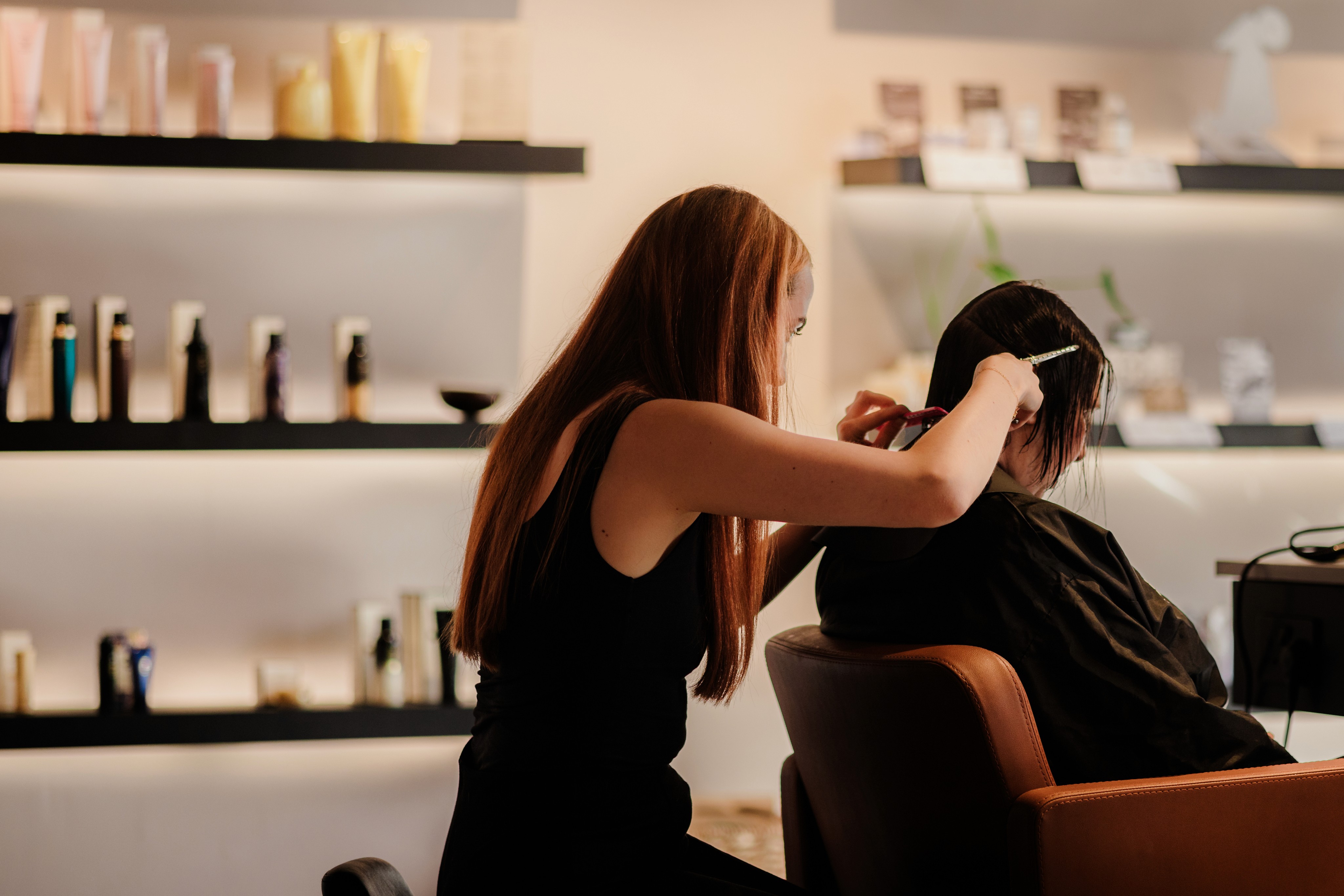 Styling hair at Emma Loen