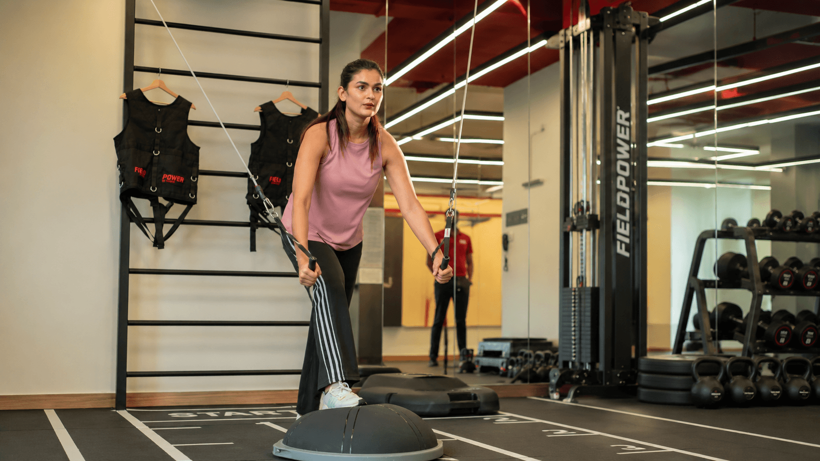 Woman performing return-to-sport conditioning and agility training at Ember & Ice Health recovery and performance studio.