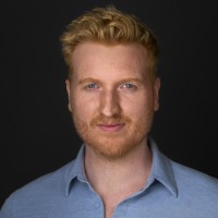 woman in black long sleeve shirt sitting on white couch